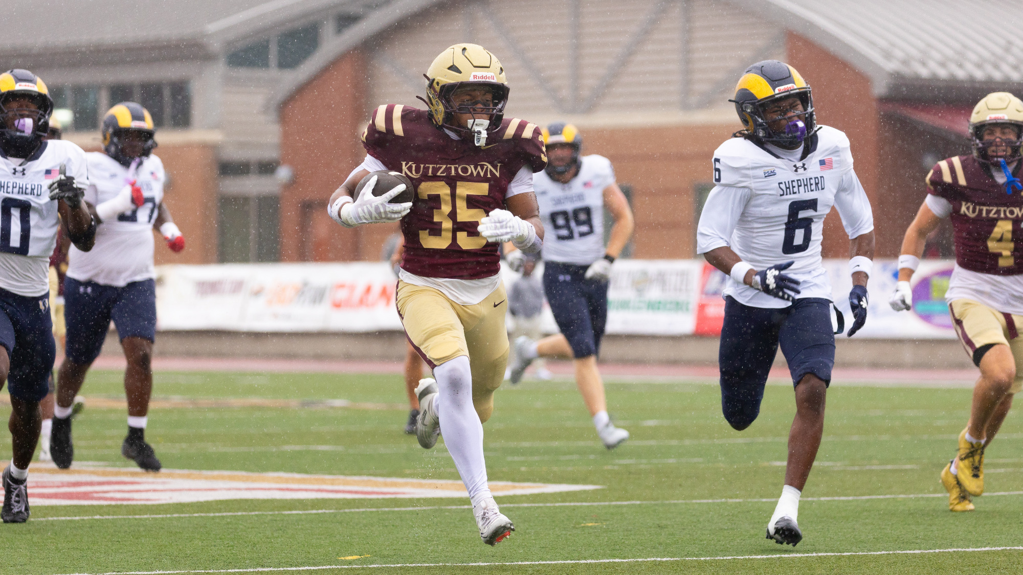 Running back Craig Miller of the Kutztown University football team outruns Shepherd defenders for a 46-yard touchdown during the second quarter of the Golden Bears' 28-12 win on Saturday, Sept. 26, 2026.