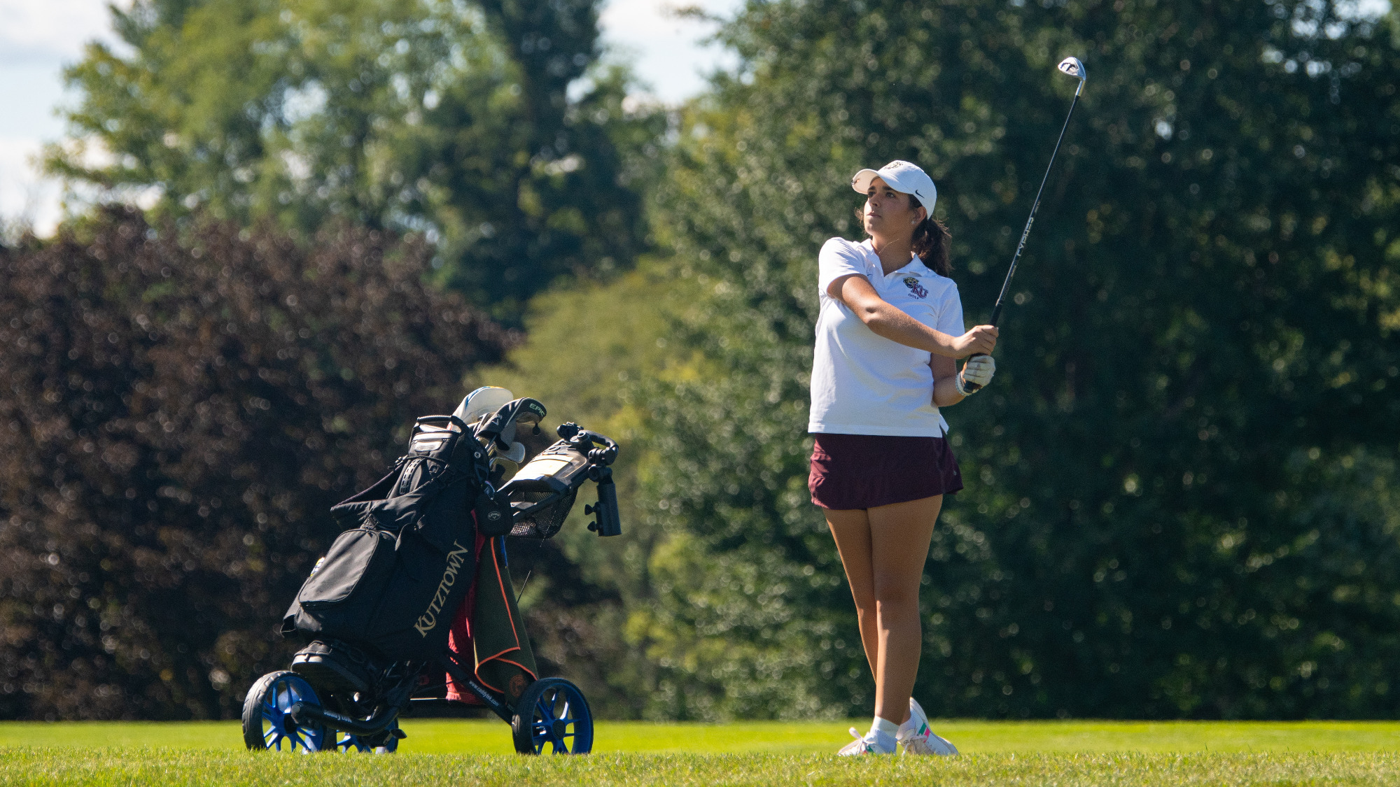 Abby McCaffrey of the Kutztown University women's golf team follows through on a shot during the first round of the Millersville Fall Invitational on Sept. 14, 2026.