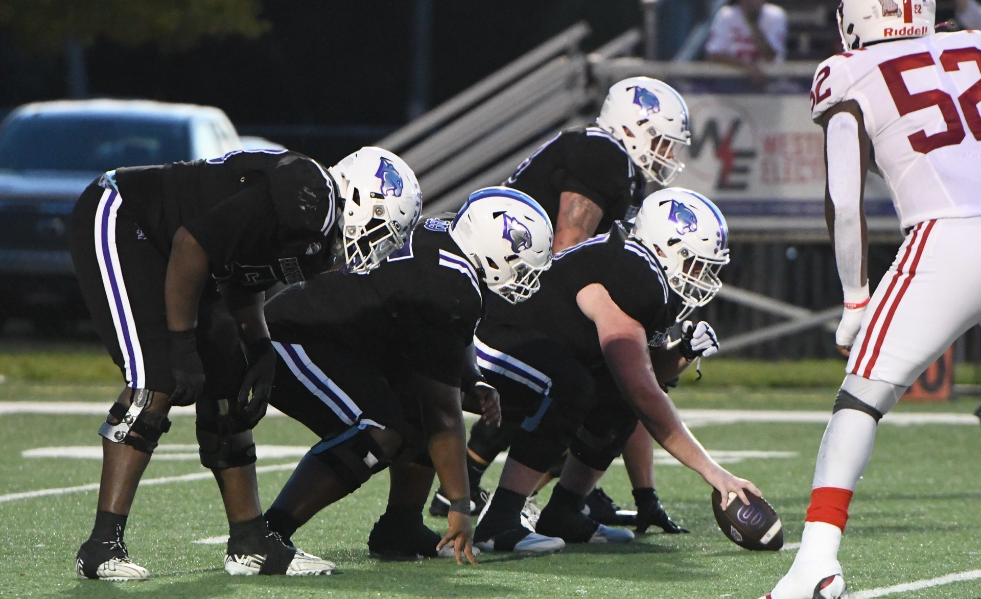 football lines up at the snap