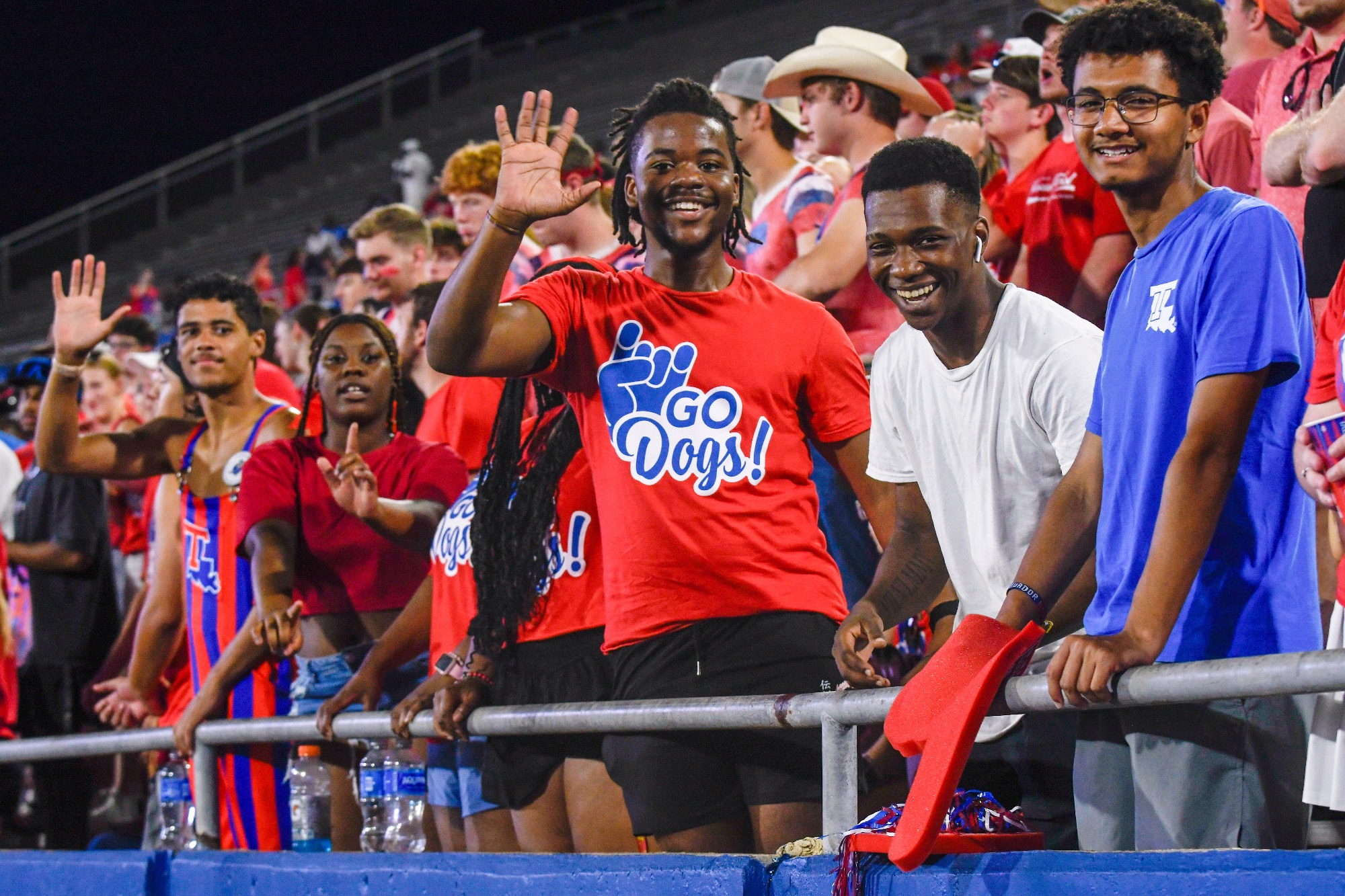 LA Tech students smiling in the football stands