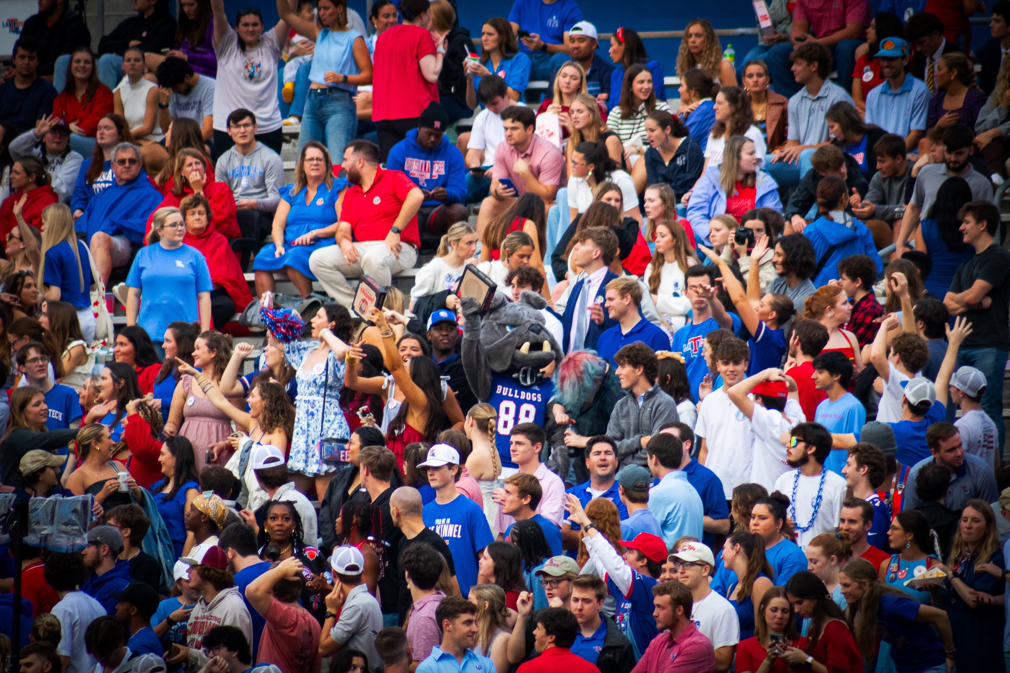 Champ celebrates with students in the LA Tech crowd