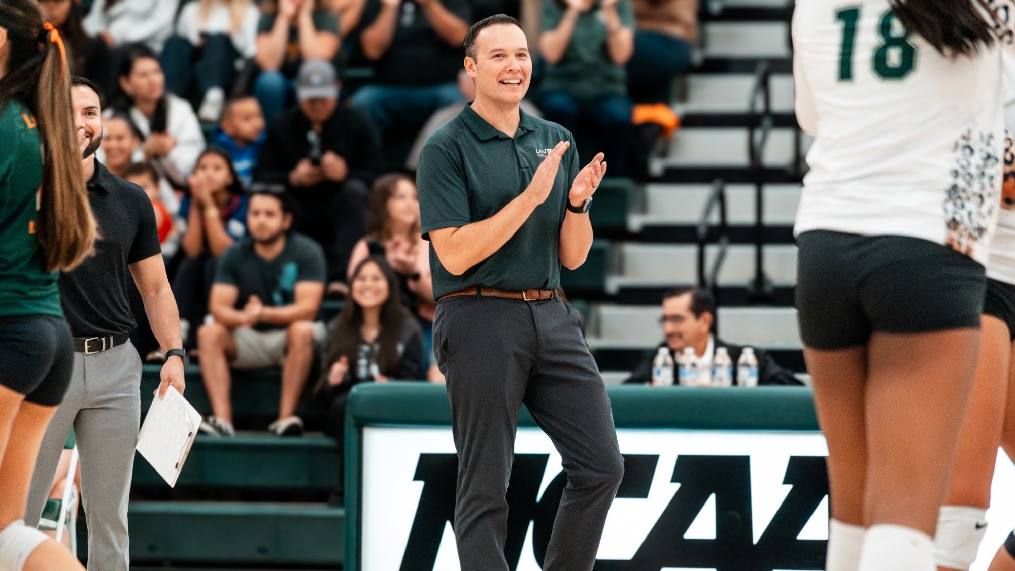 La Verne Volleyball Head Coach Jeff Hendershot cheers on his squad
