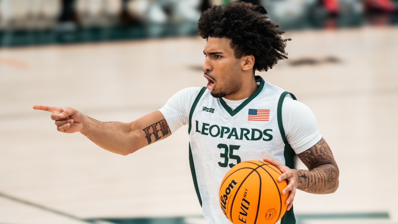 James Christian directs the offense as he moves down the court