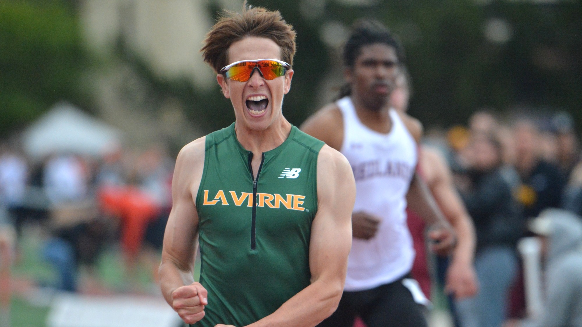 Zachary Reid celebrates after winning the SCIAC 110m hurdles