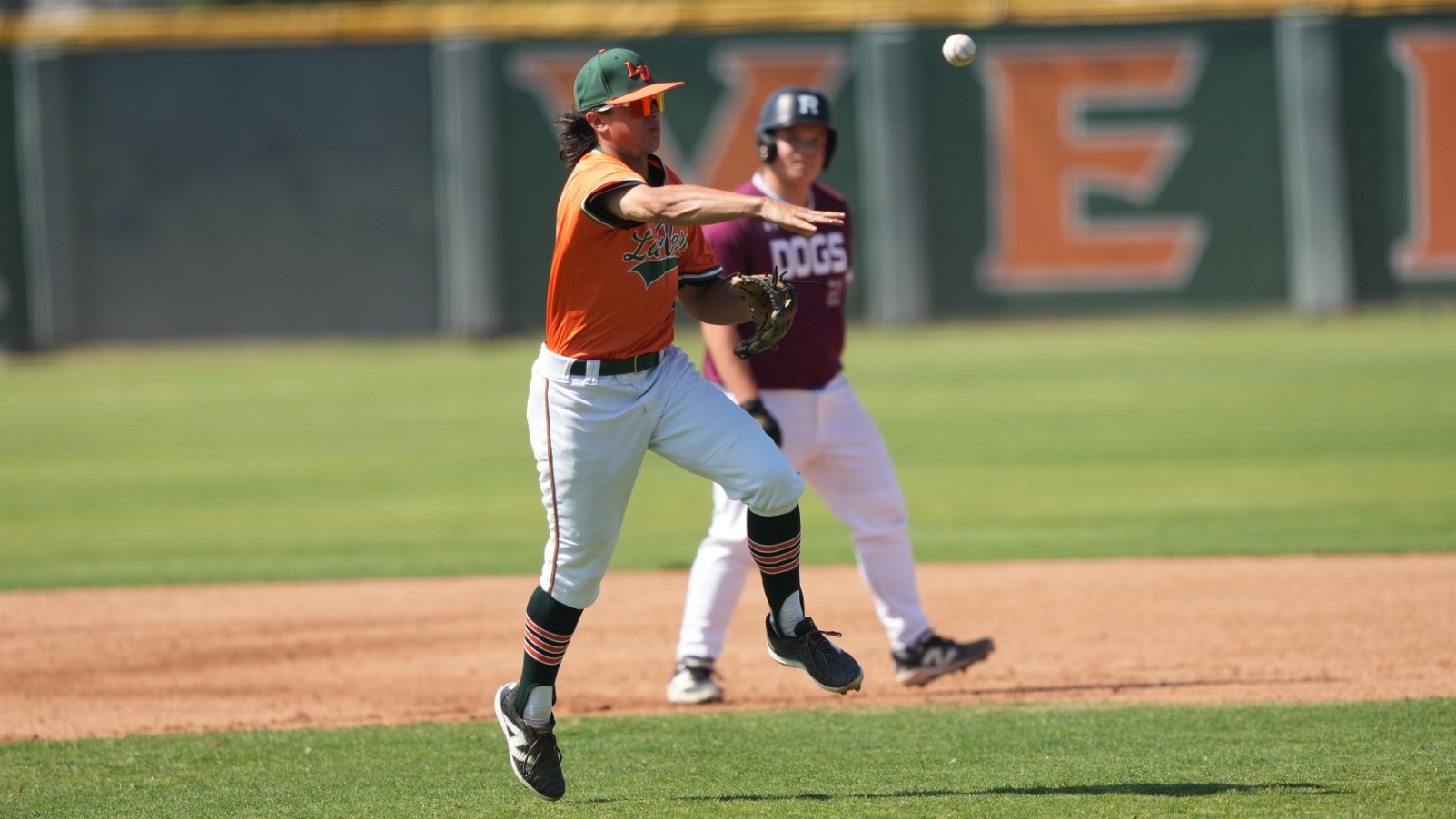 Ryan Vosika makes throws a runner at first base