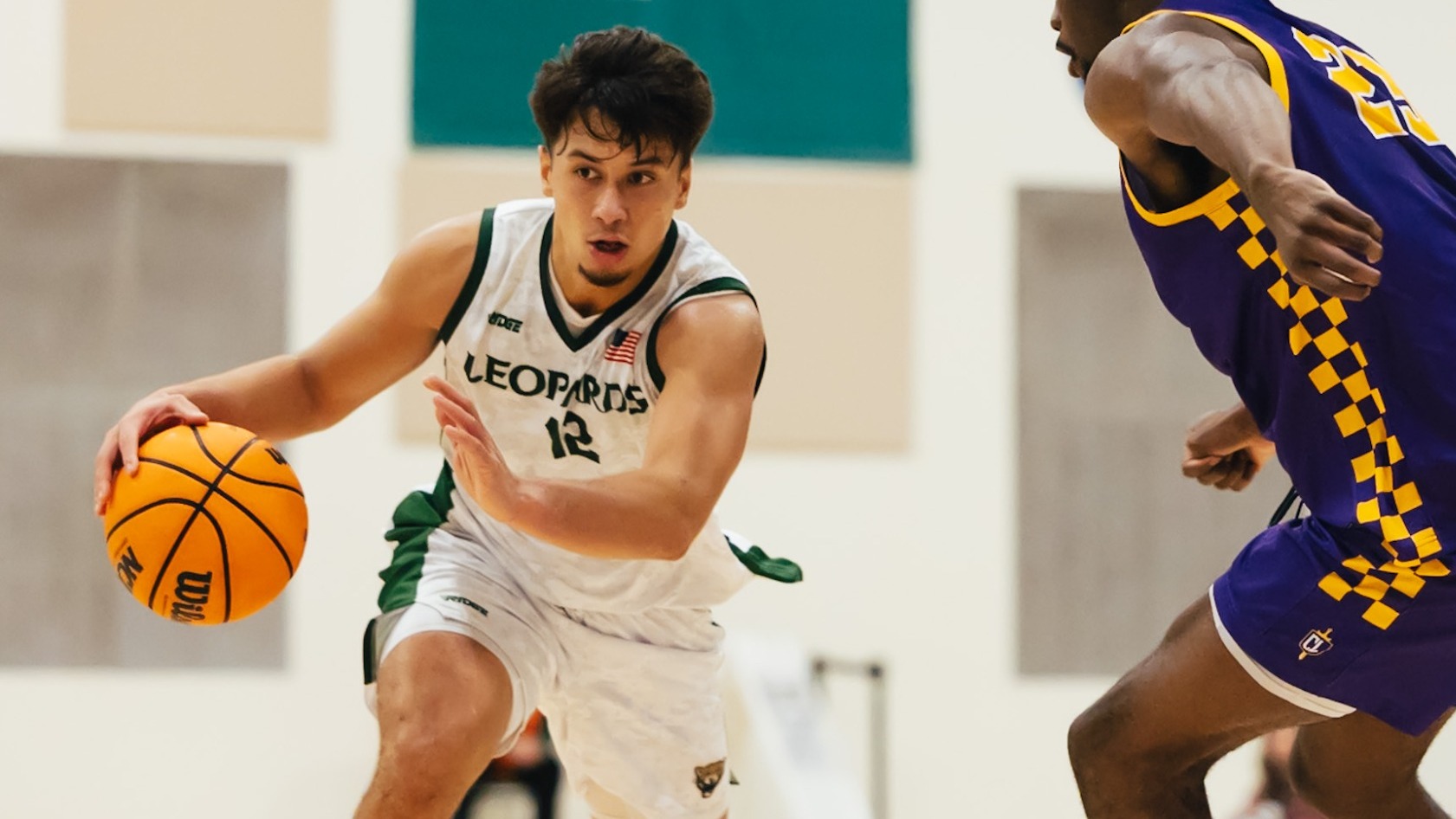 Higgy Katoa drives against Cal Lutheran