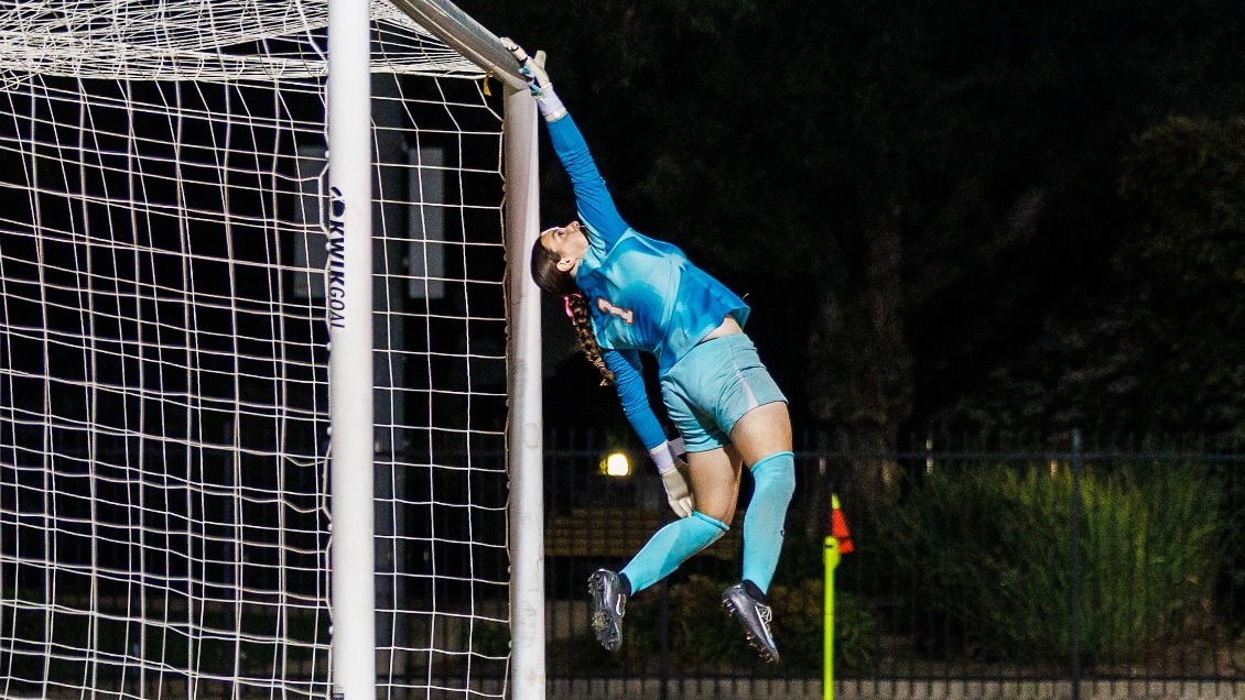 Katy Blue makes a leaping save against APU