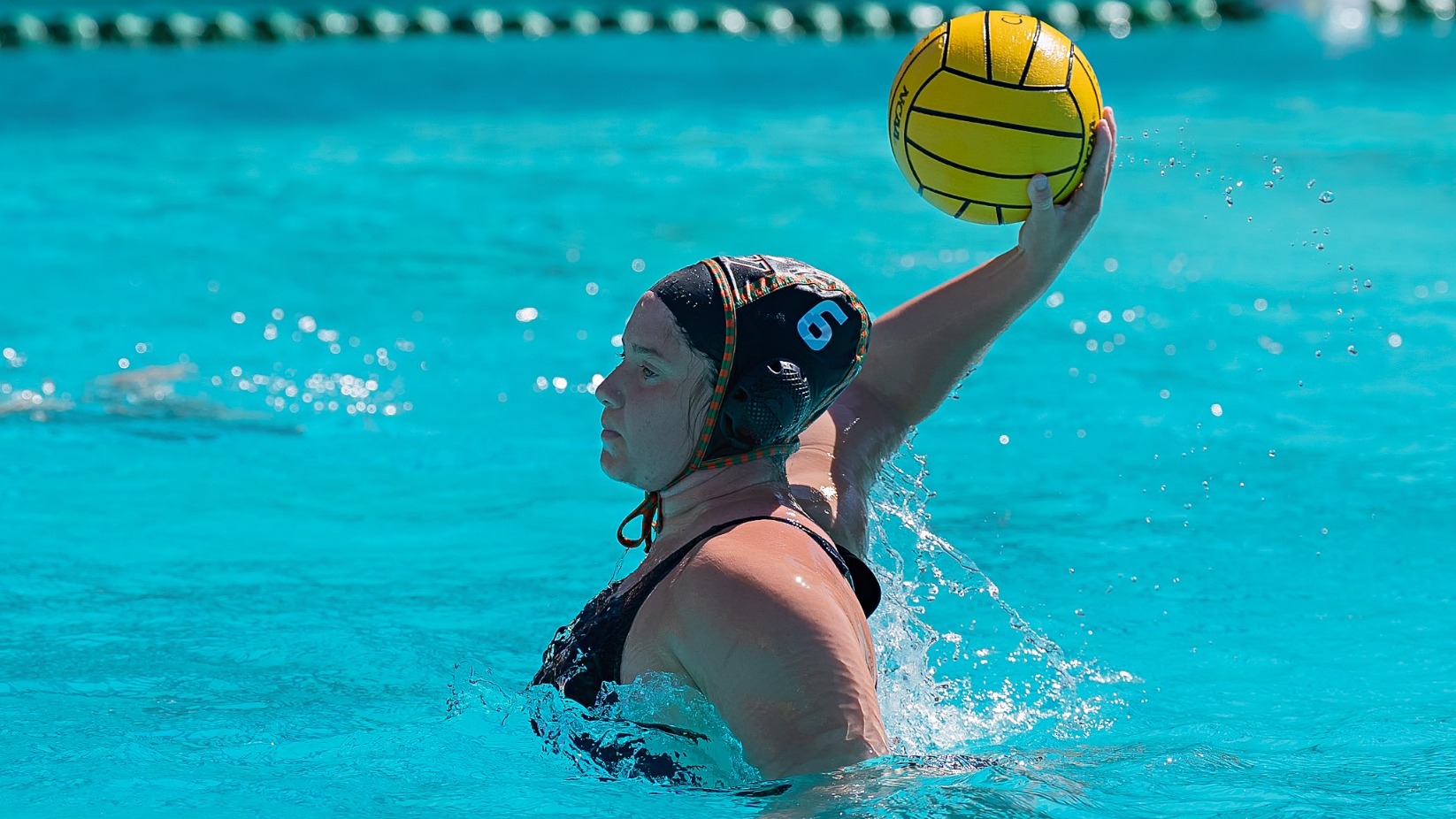 Ally Rato dishes a pass against Austin College