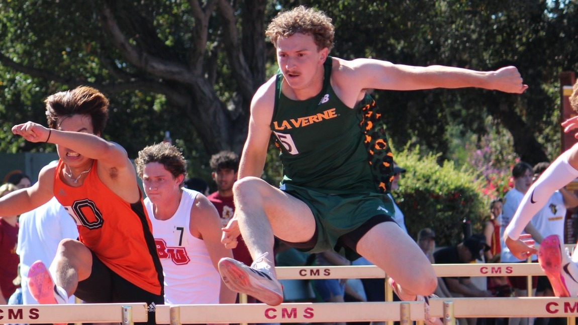 Hunter Bond hurdles at the CMS Rossi Relays
