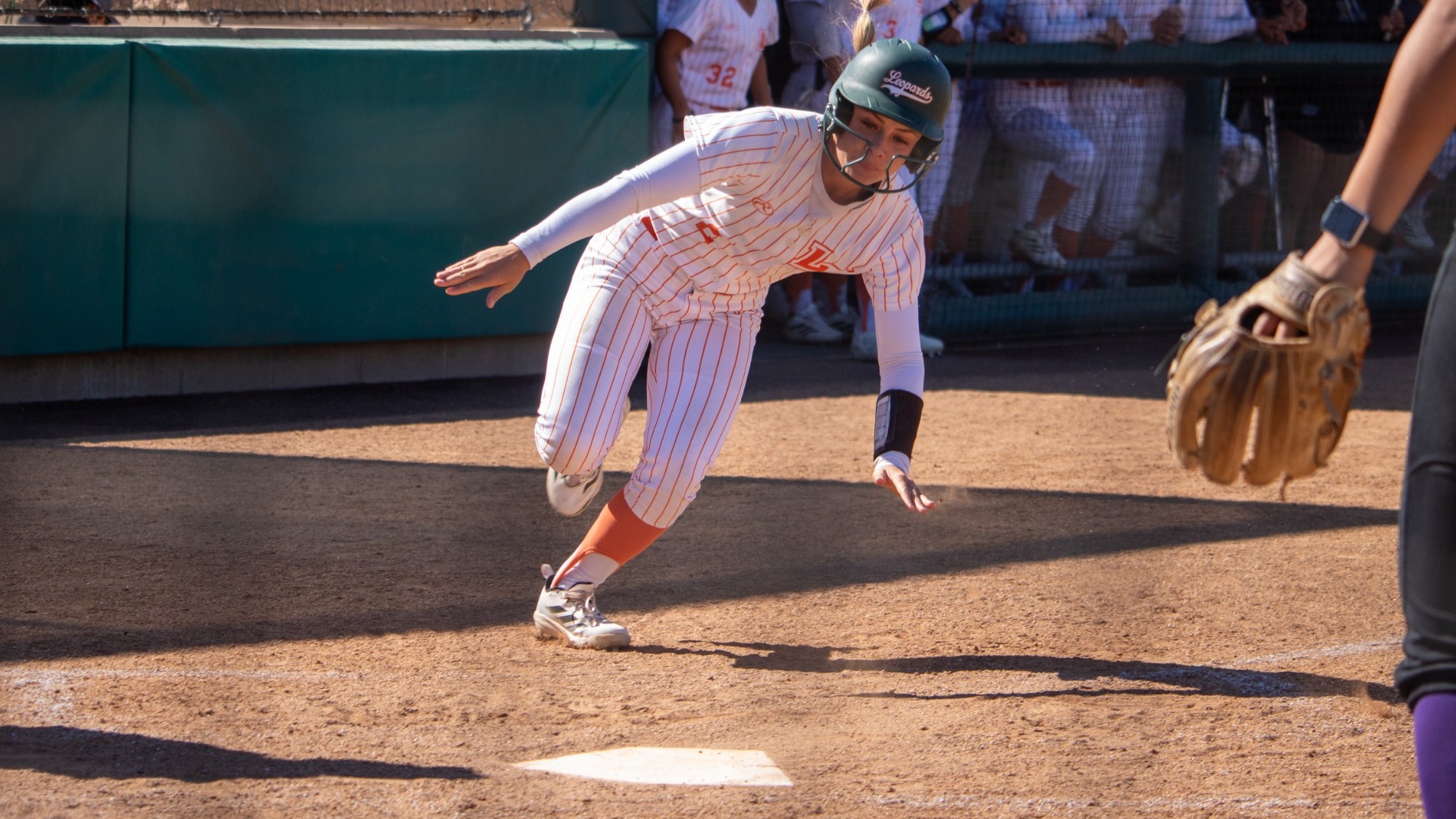 Kylee Knight slides into home against Whittier