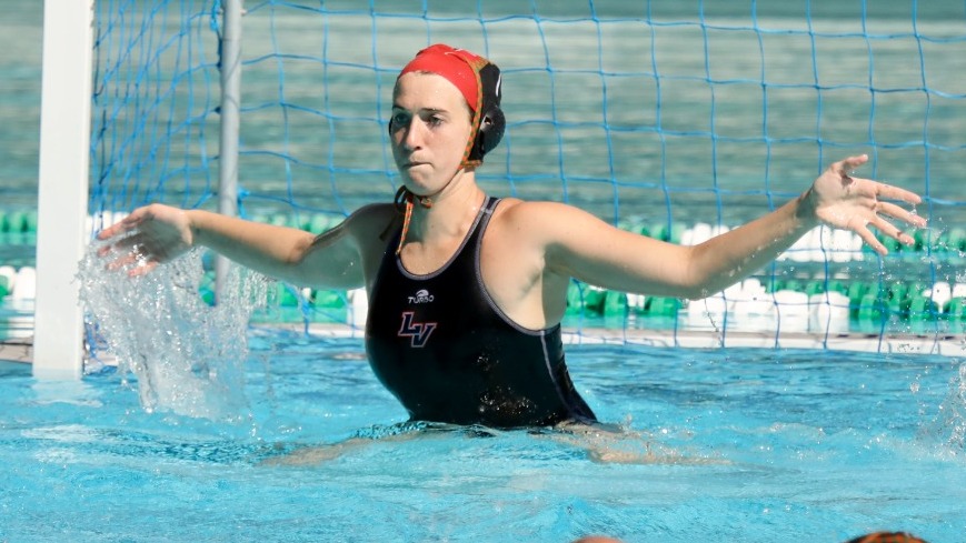 Miranda Graham gets ready to defend a shot against Cal Lutheran.