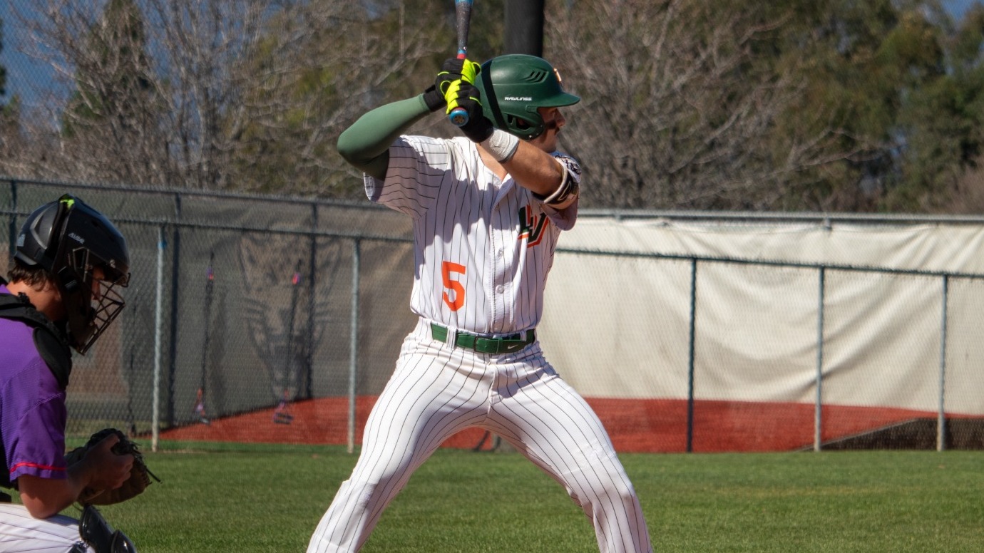 Nate Perry waits for his pitch against Linfield