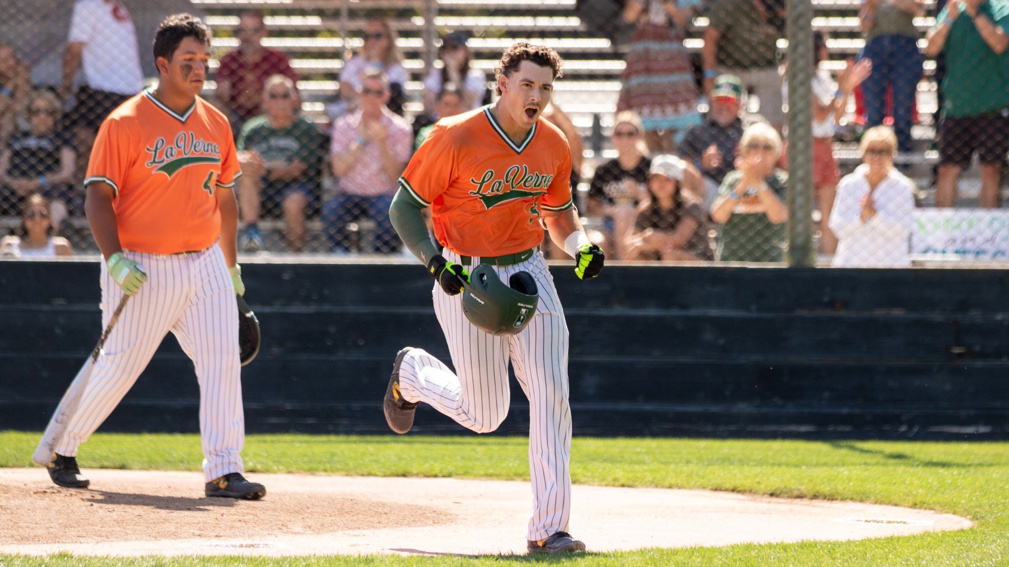 Nate Perry celebrates after hitting a home run against CMS in round 2 of the SCIAC Tournament