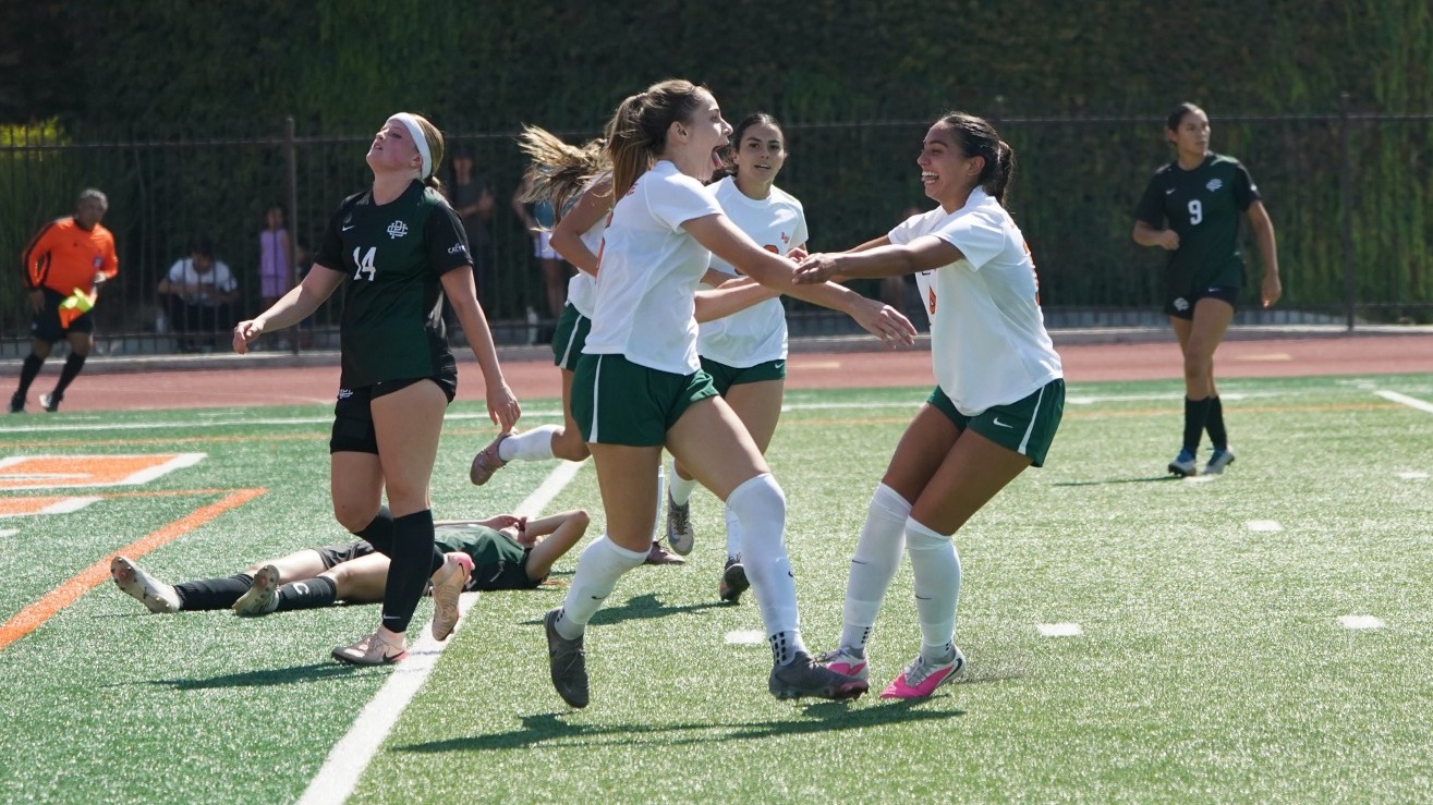 Bridget Ward celebrates with Jessica Figueroa after scoring against Pacific Union