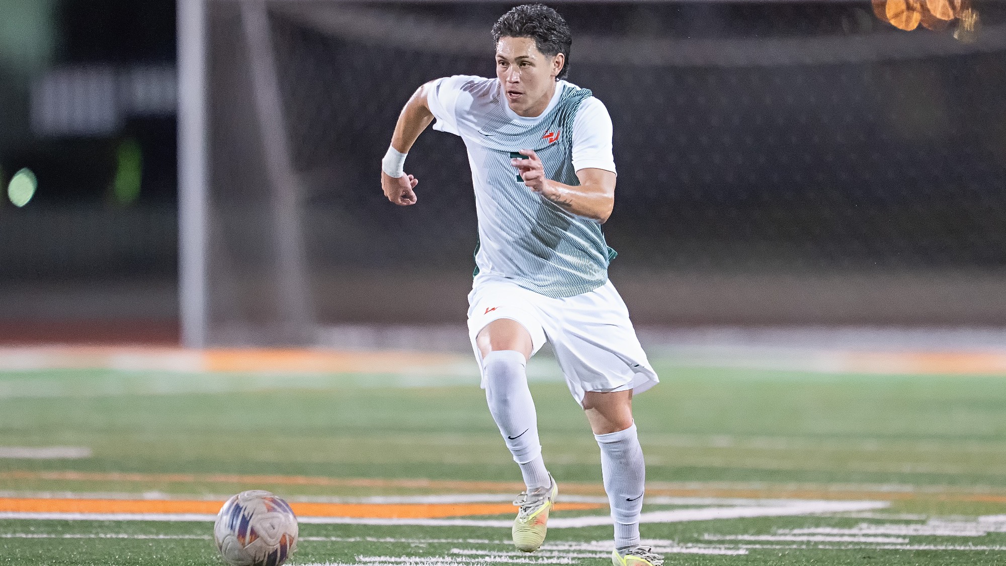 Alex Bastidas drives against George Fox