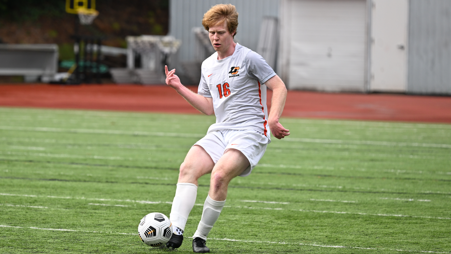 Emmett Olson passes the ball to a teammate