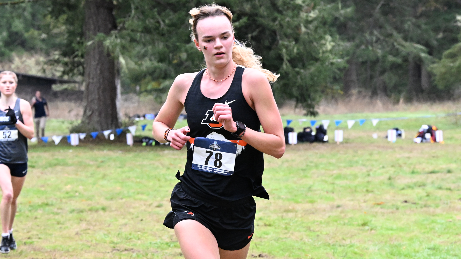 Malia Heien runs through a field 