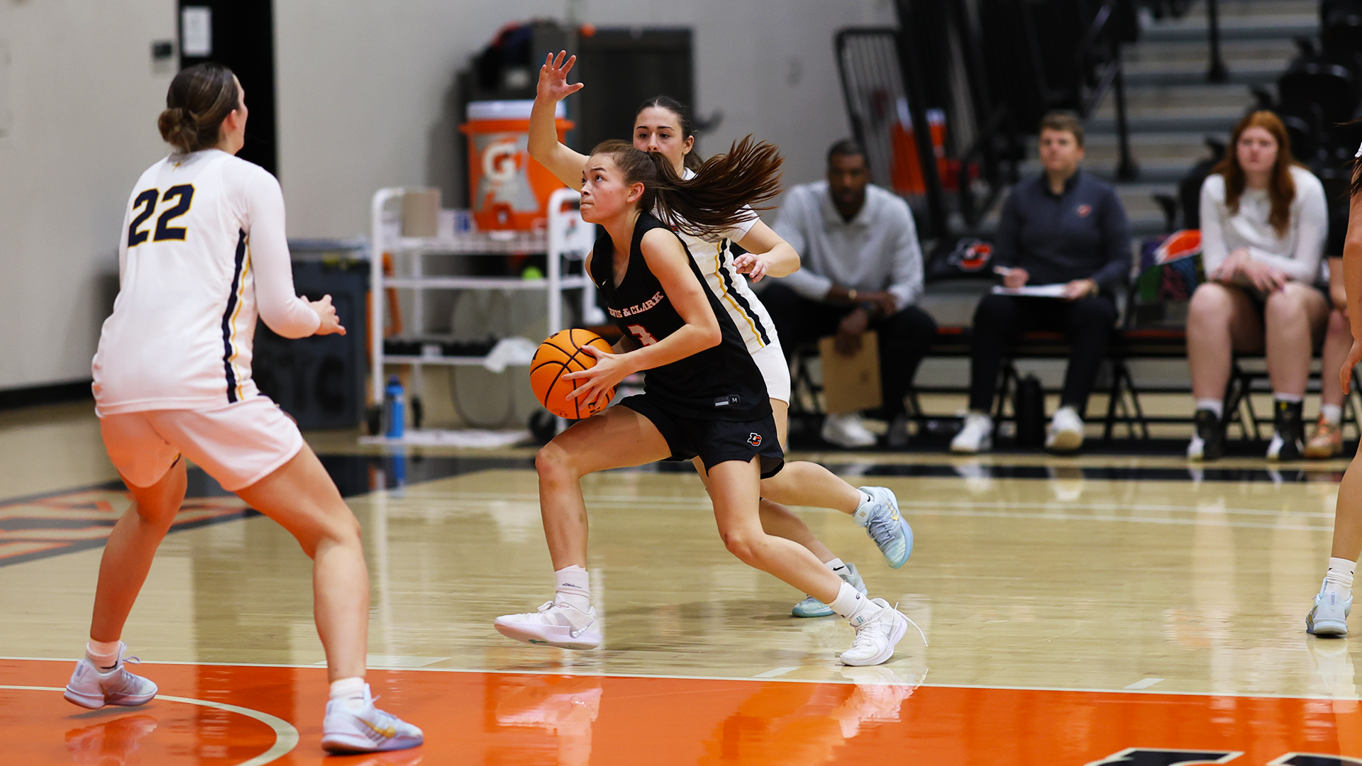 Kaitlen Carns drives to the basket against two Northwest defenders