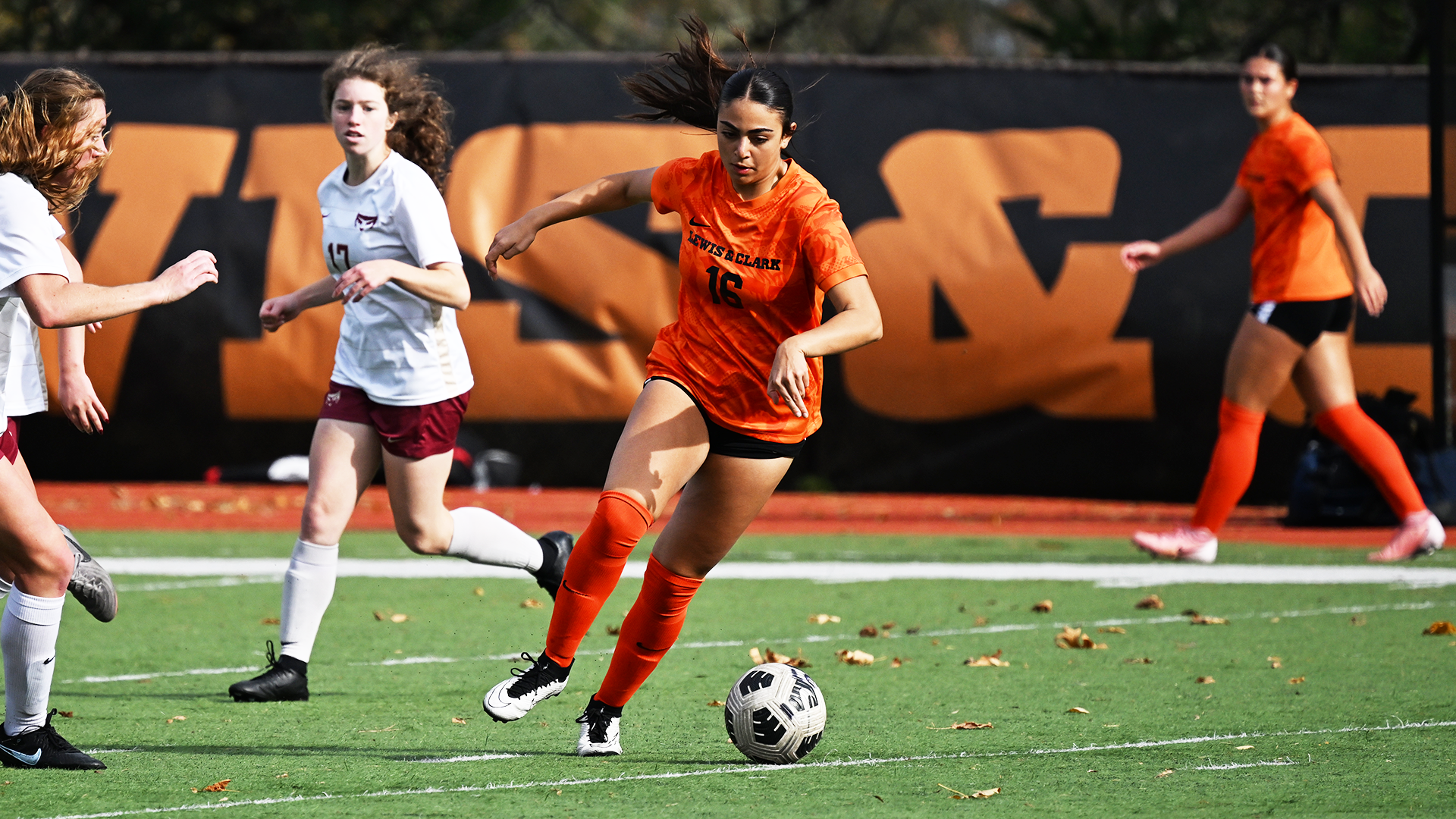 Ava Lazzara goes for a soccer ball against a defender. 