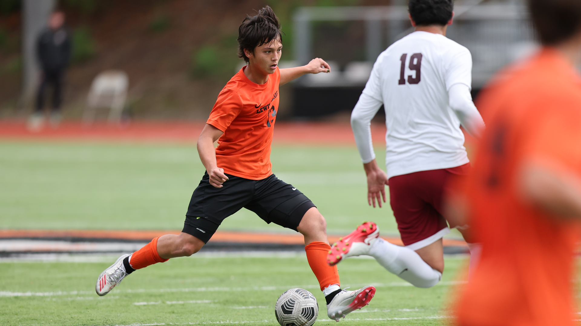 Aleister Alfstad looks to make a pass through traffic