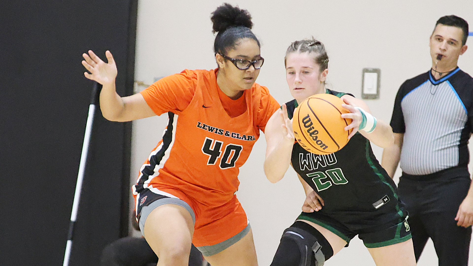 Kaela Guidry defends the basket against an opposing player. 