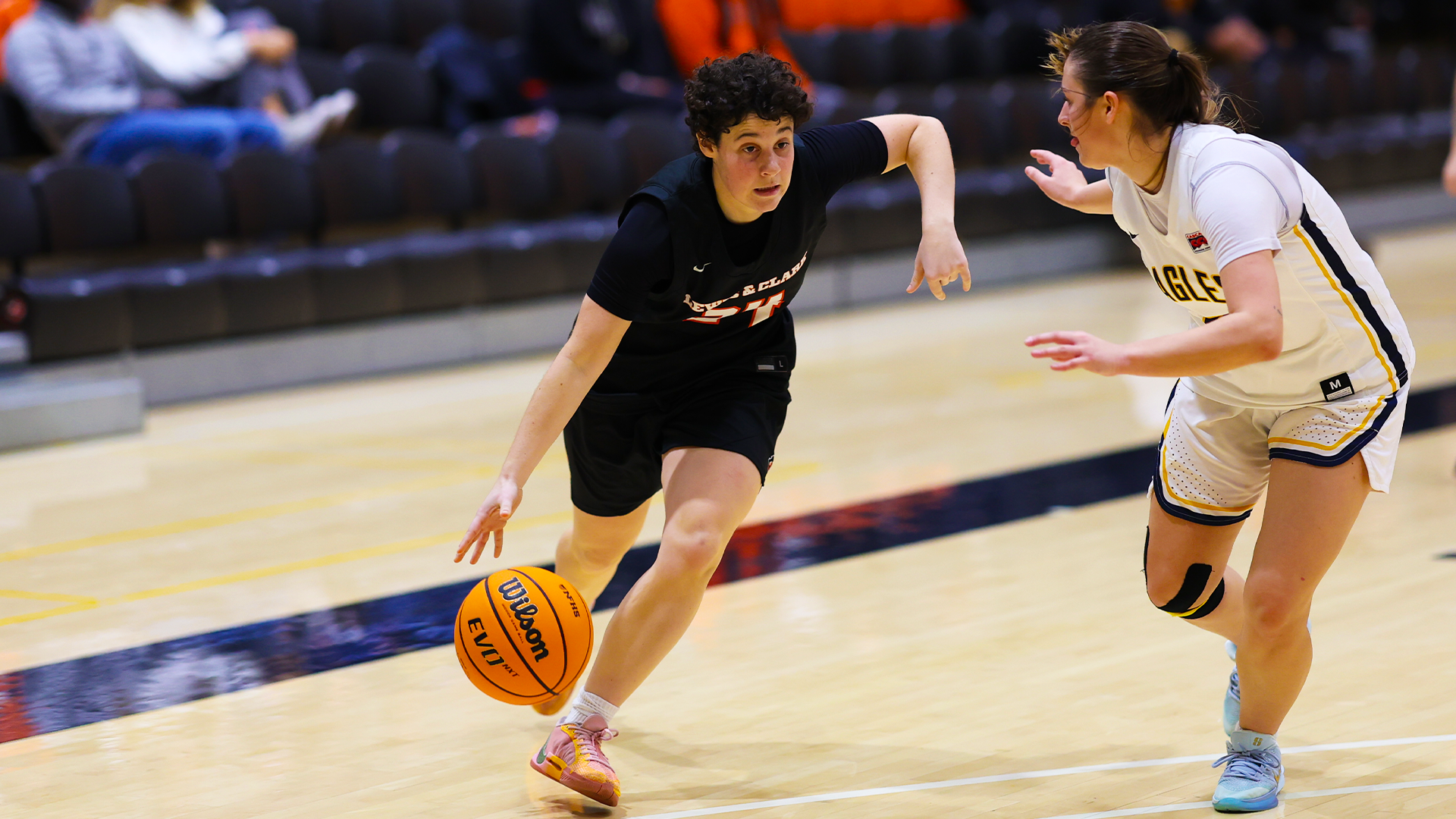 Ali McCauley drives to the basket against a defender. 