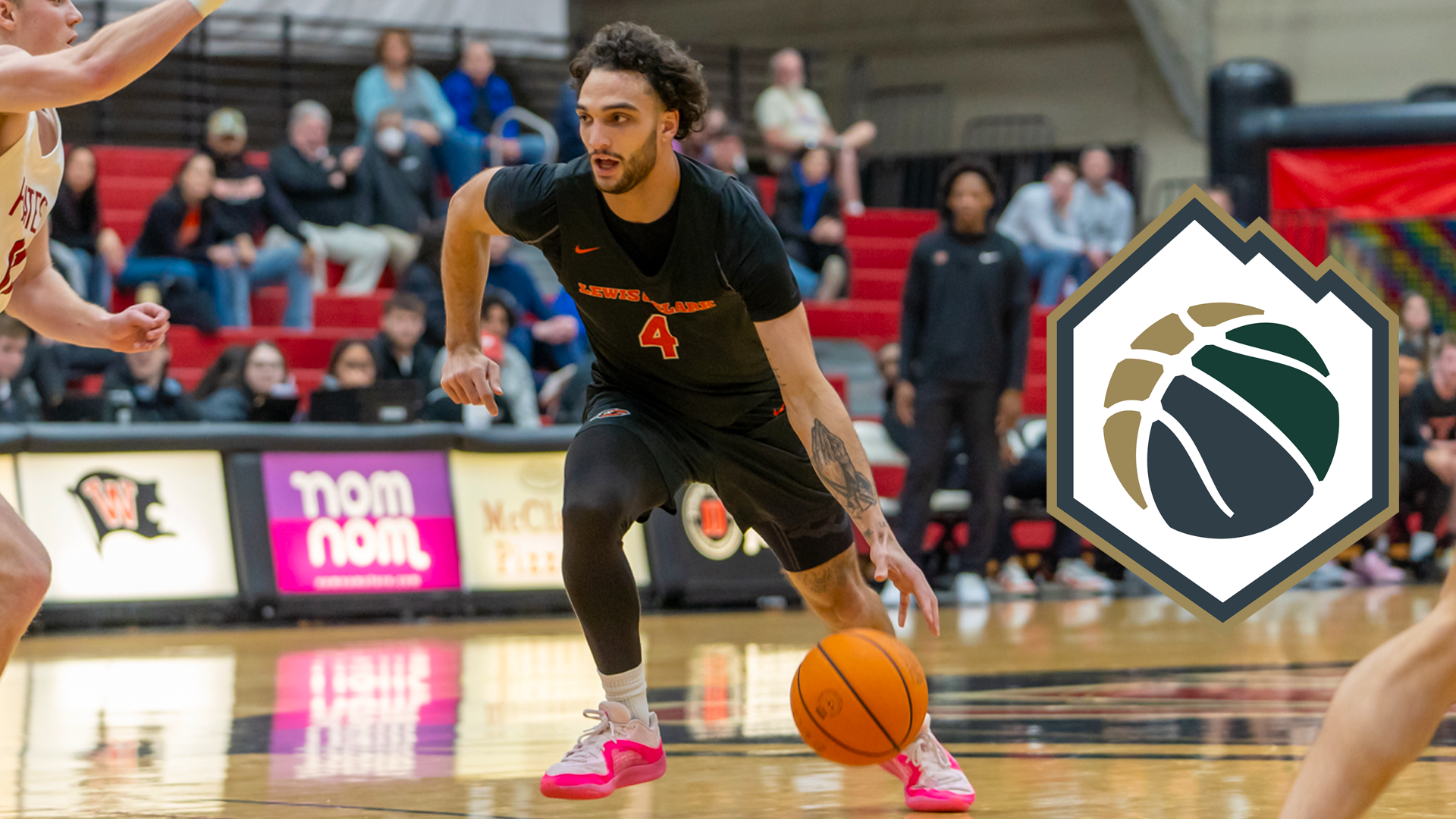 AndreTreadwell dribbles the ball down the court.