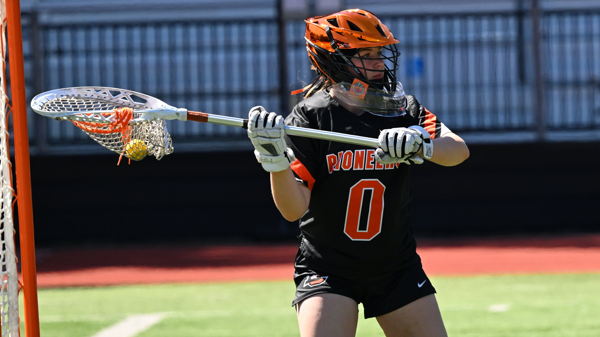 Zoey Hamel-Hyland looks up field for someone to pass the ball to