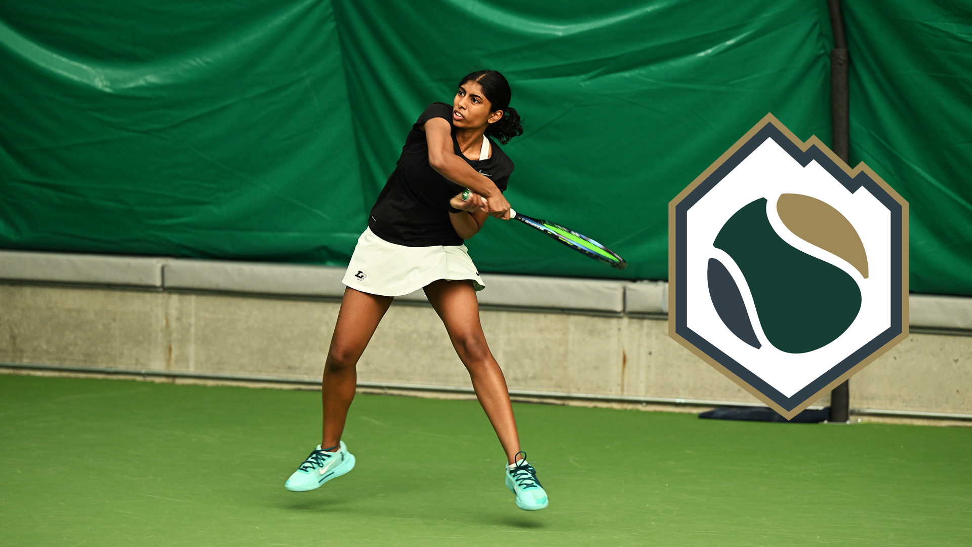 Susanna Anand hits a baseline forehand return. 