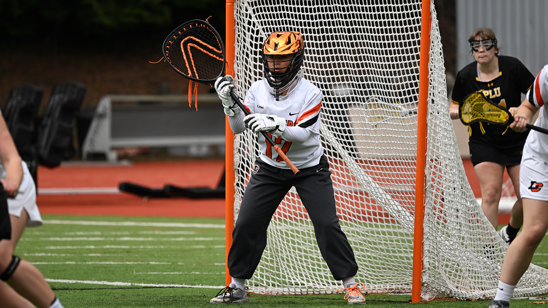 Kaitlin McRae stands in front of the net watching the opposing offense. 