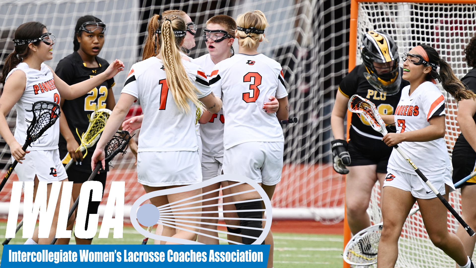 Women's lacrosse players huddle up and celebrate after a Mack Searle goal