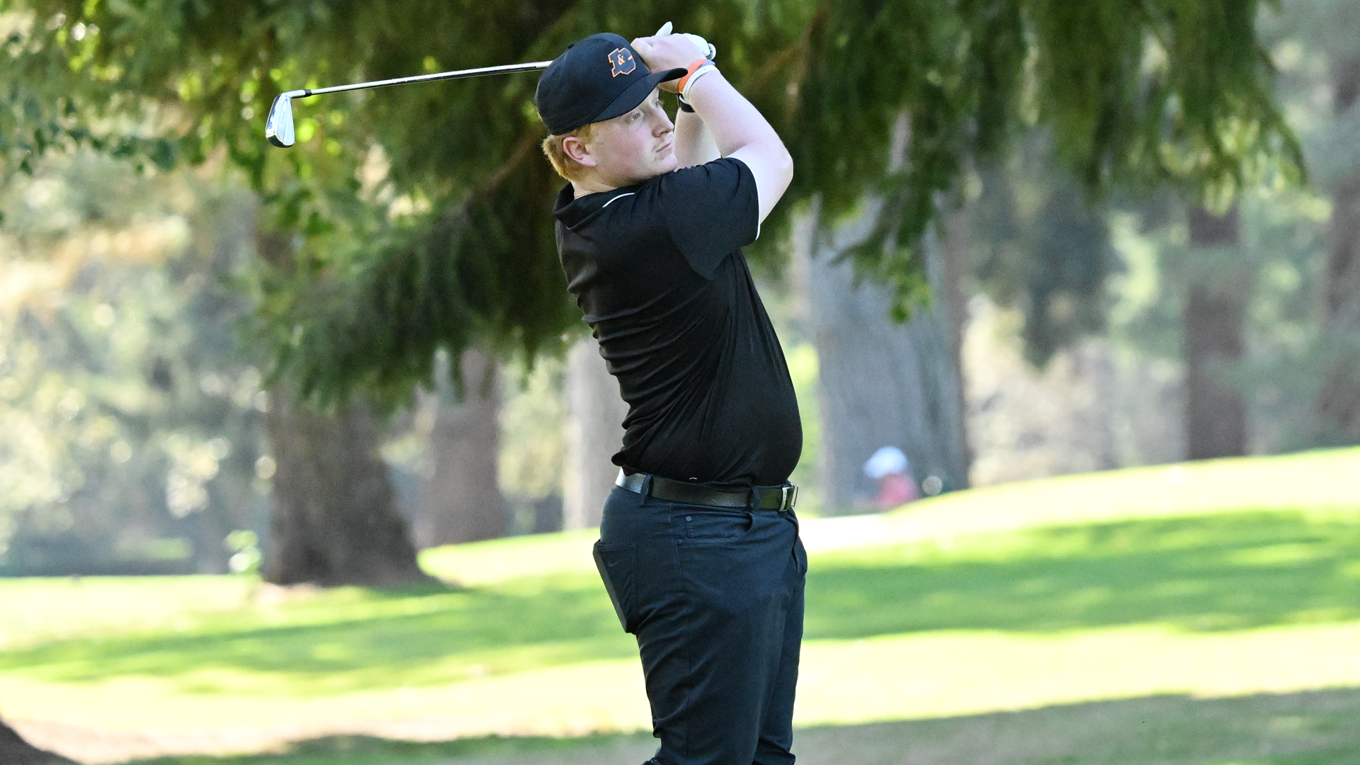 Nate Loew watches his iron shot fly towards the green at the Orange & Black Invitational 2025