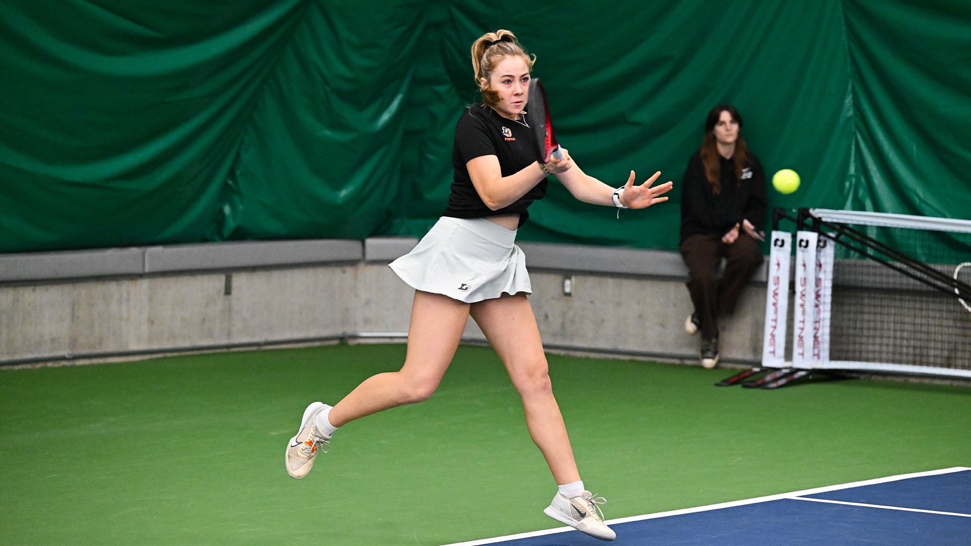 Taylor Stadjuhar hits a baseline forehand. 