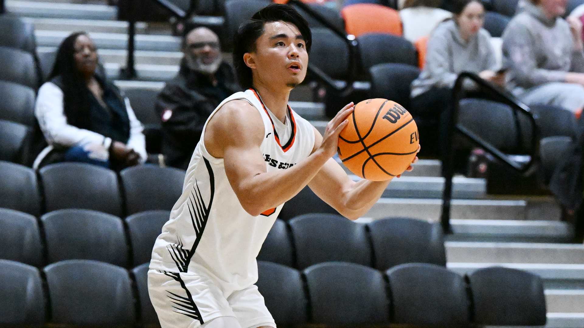 Kody Uyesugi aims a three-pointer in a the game. 