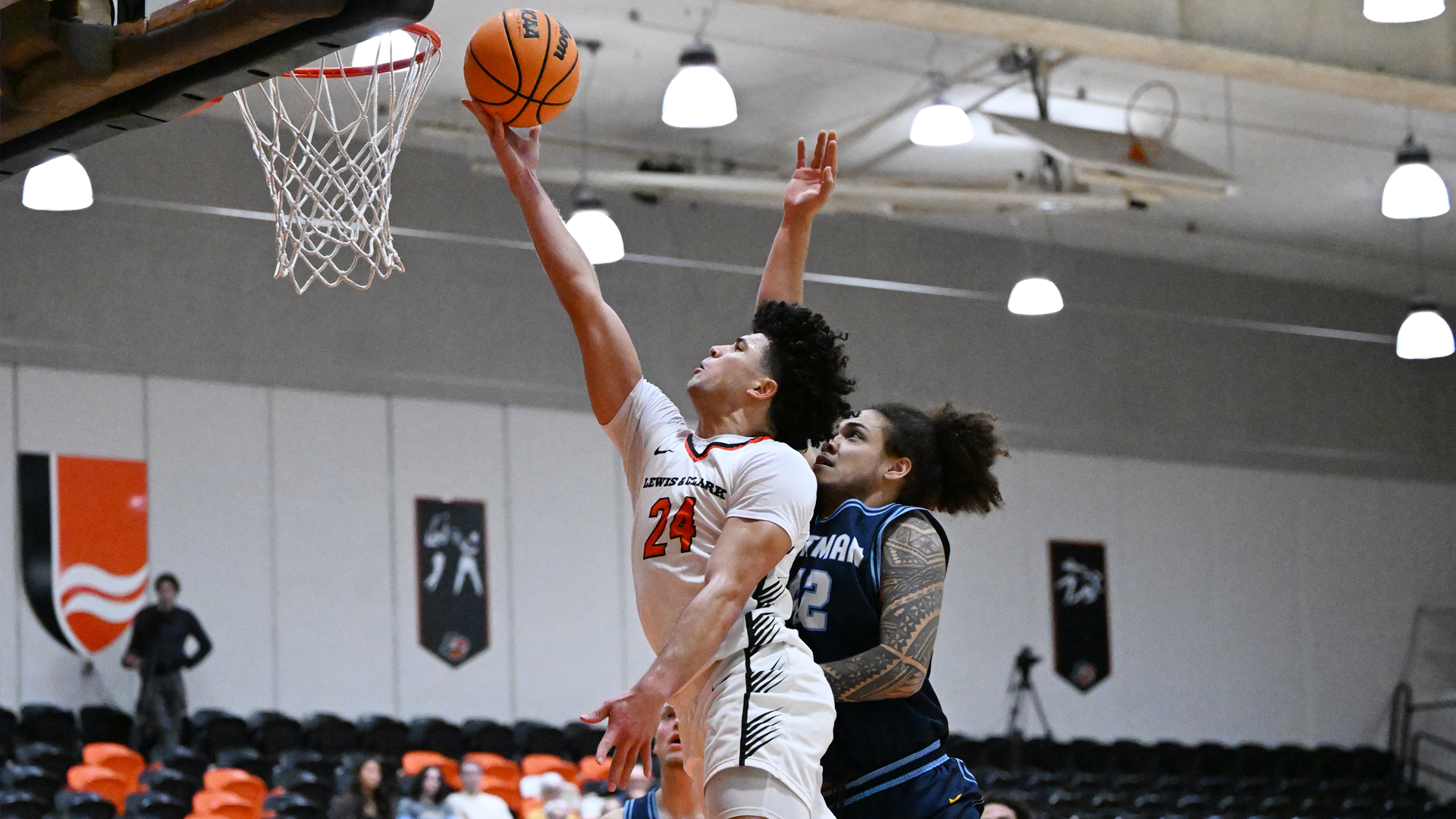 Joe Brown jumps up for a layup with a Whitman defender trying to block the ball
