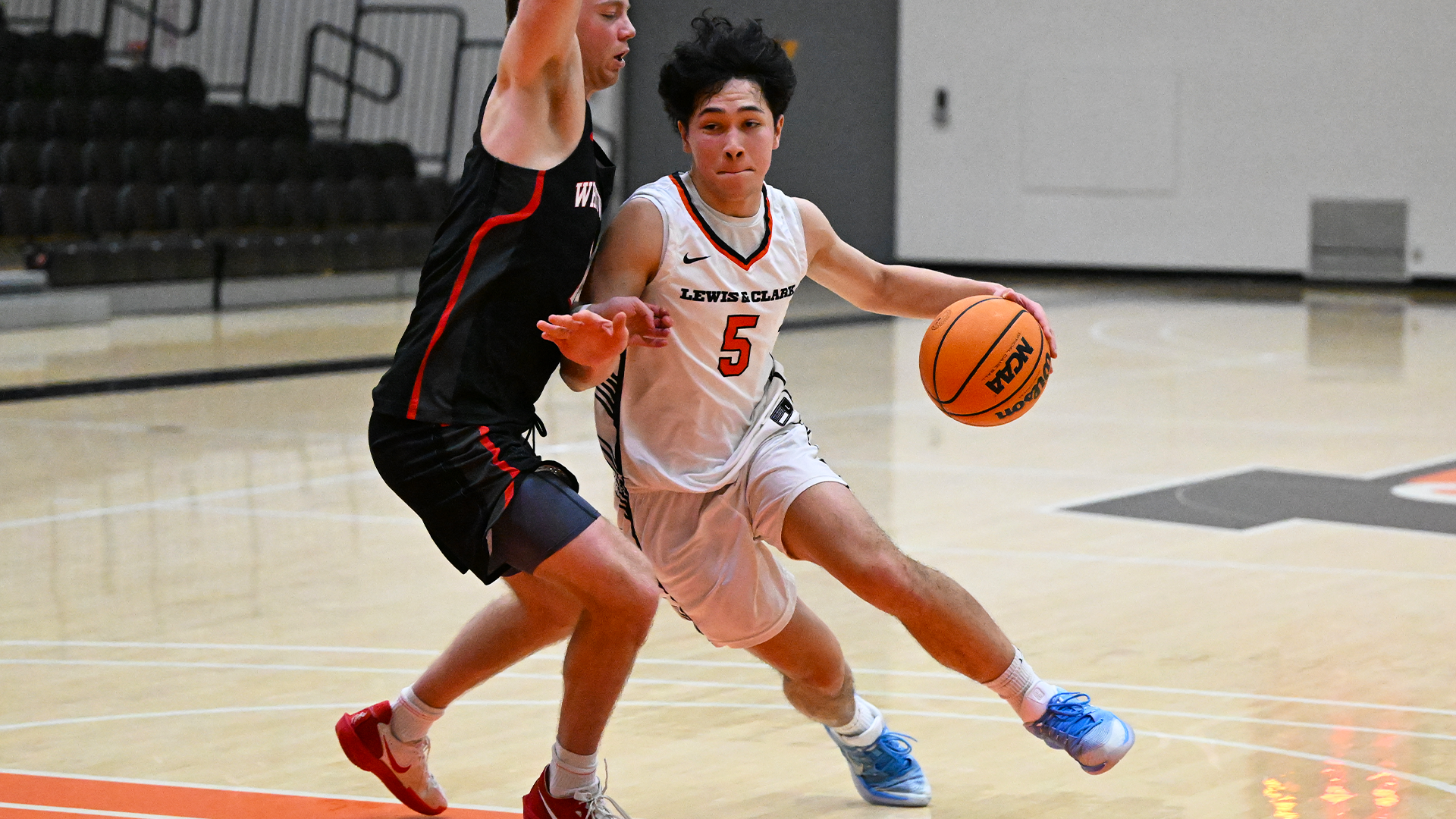 Marcus Bast drives the lane against a defender. 