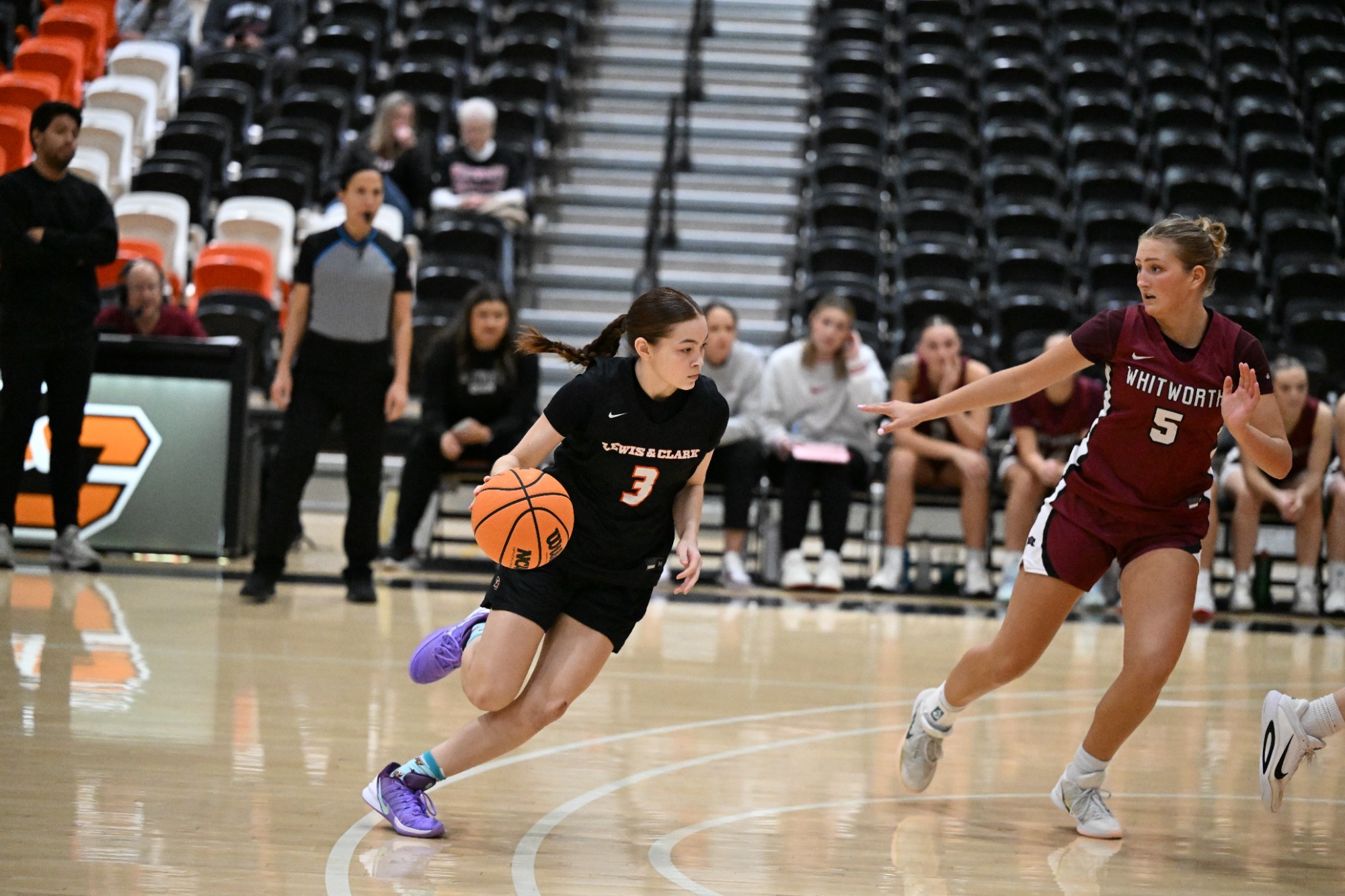 Kaitlen Carns dribbles the ball against a defender. 