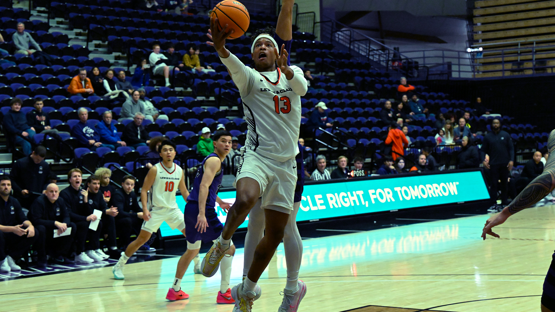 Justin White goes up for a layup with against a defender. 