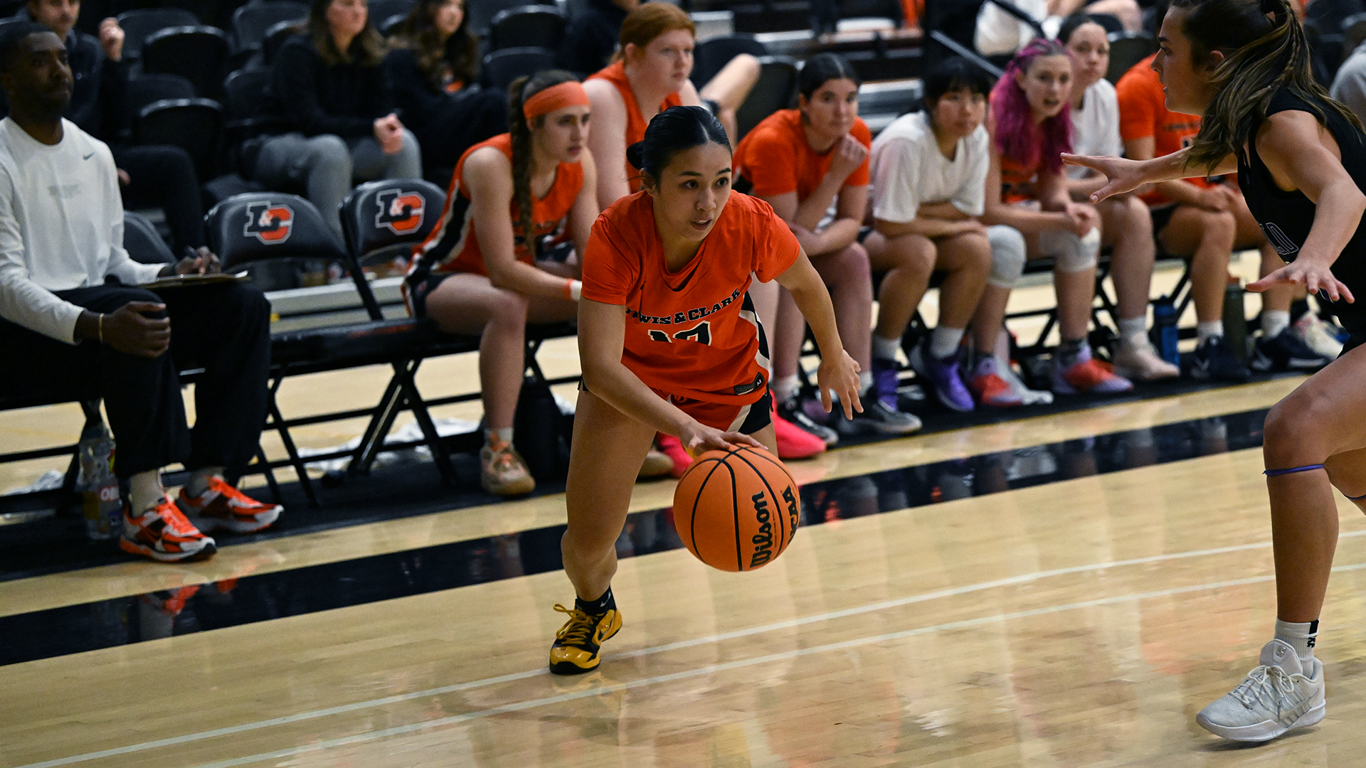 Hailey Perez drives the baseline against a defender. 