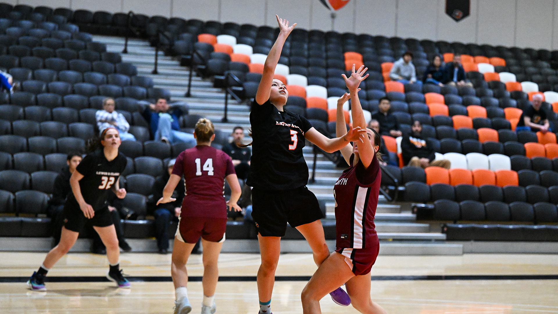Kaitlen Carns shoots the basketball against a defender. 