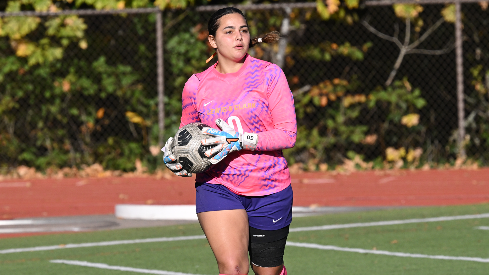 Lucia Barrón Núñez runs with the ball against Whitworth