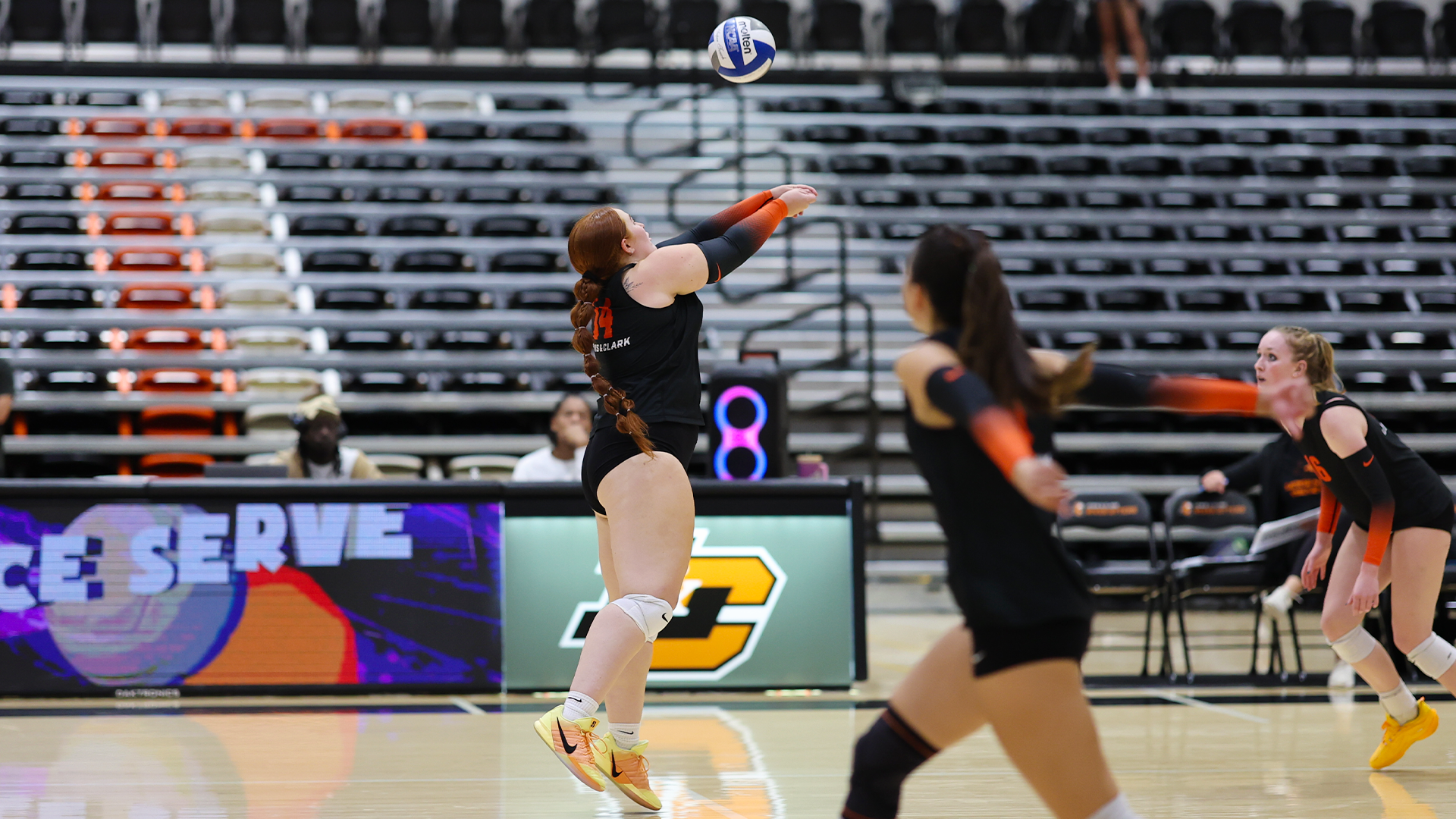 Abbi Sanchez pass sets the ball.