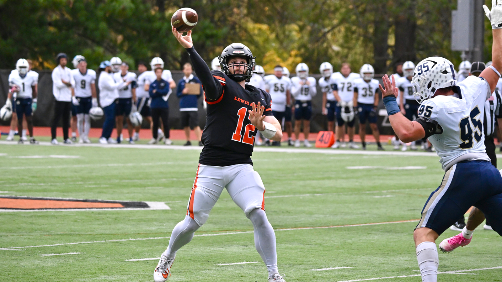 Sam Simril throws a pass on Homecoming