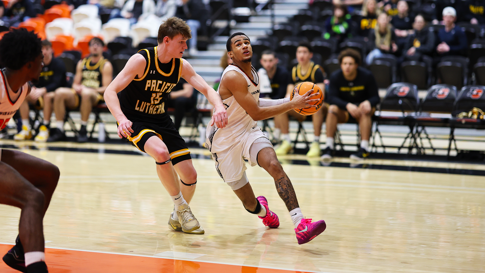 Donovan Beard drives to the hoop against a defender. 