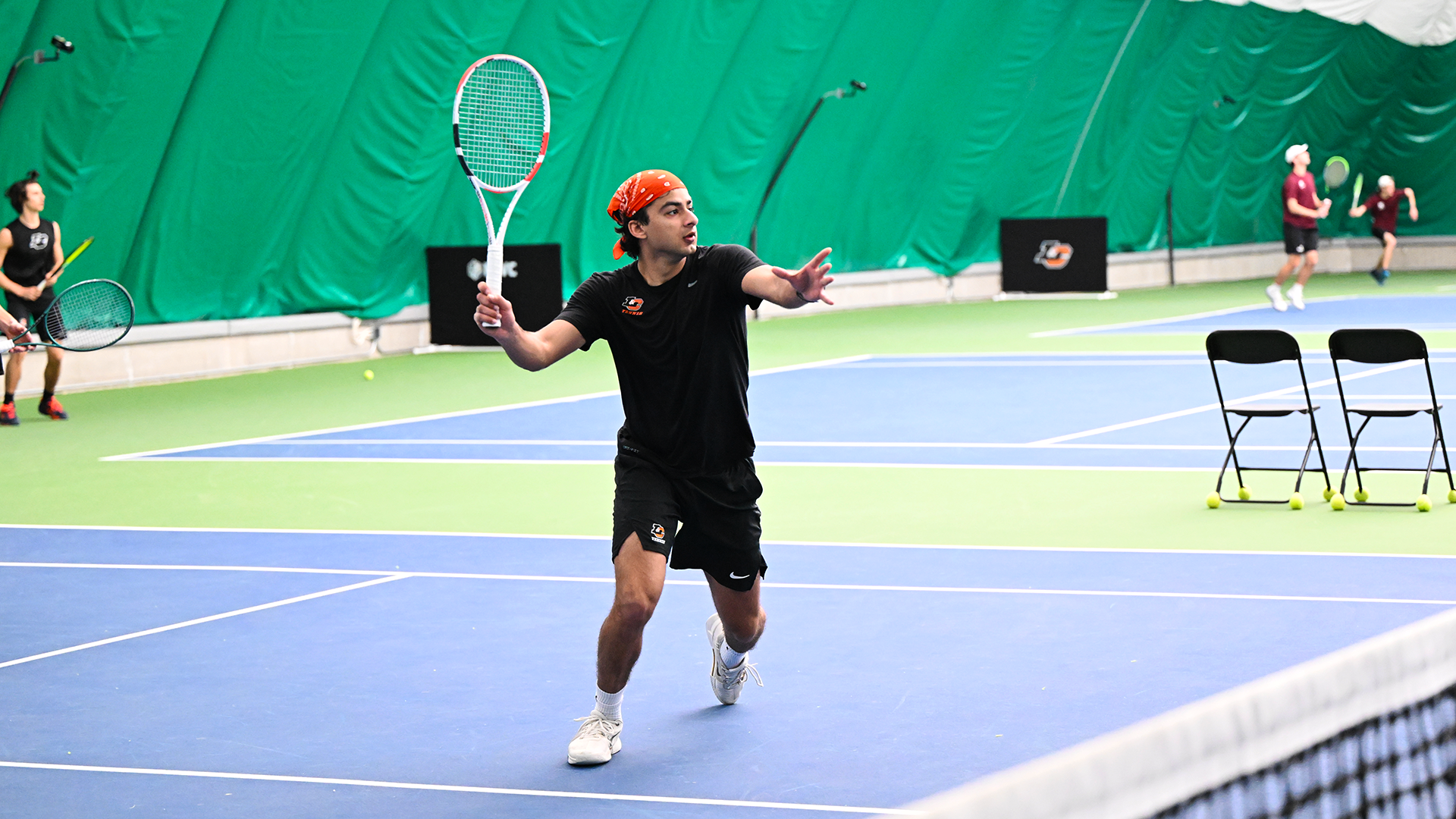 Arnav Bishnoi hits a forehand volley.