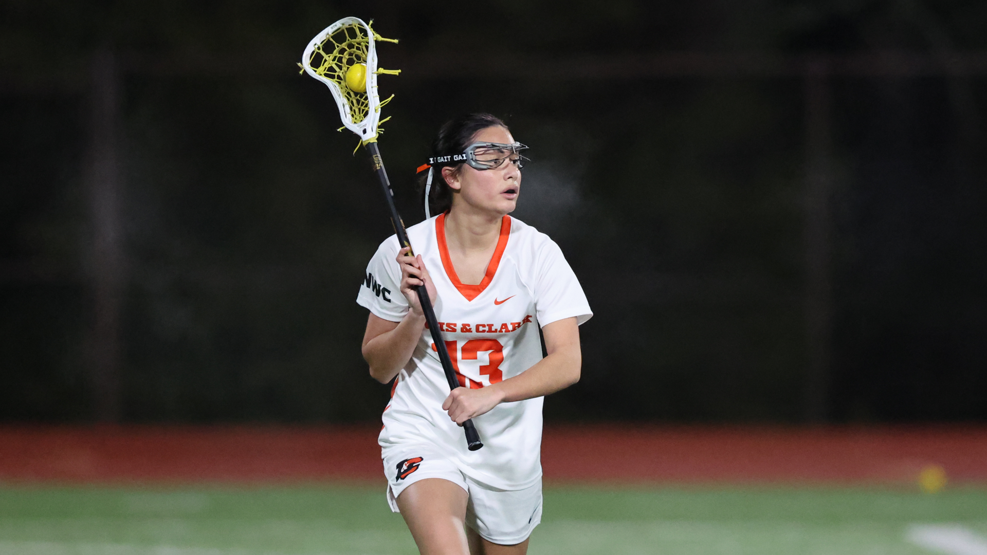 Ala Cross looks for an open player with the ball. 