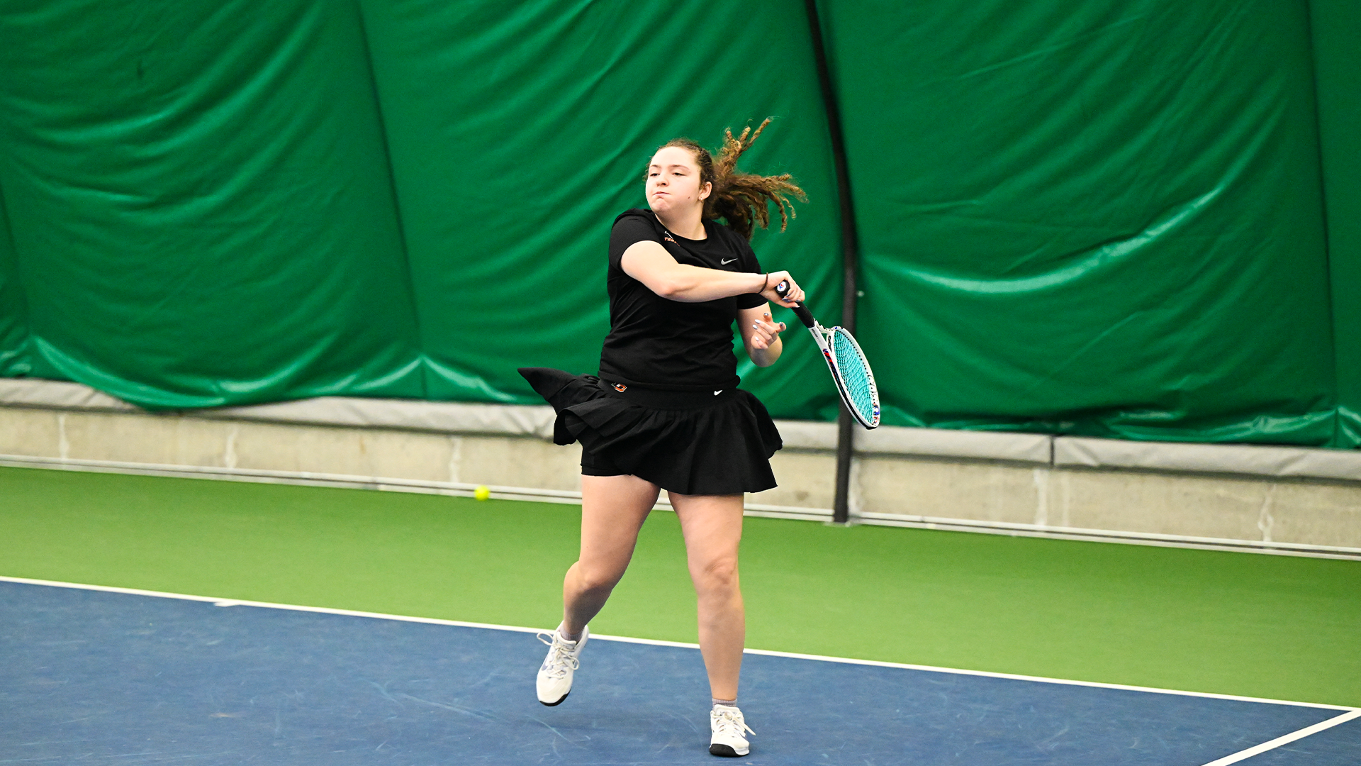 Emma Loucks hits a forehand shot. 