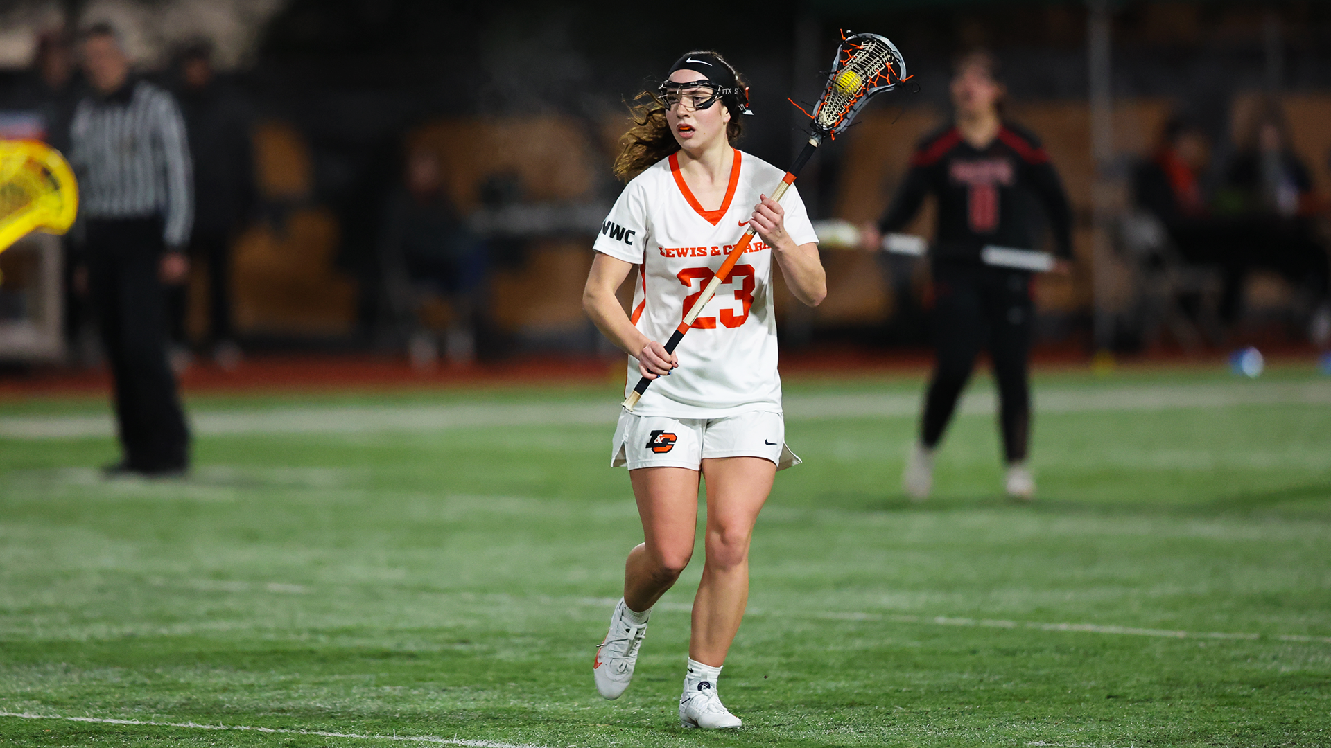 Sage Swegle carries the ball and looks for an open player. 