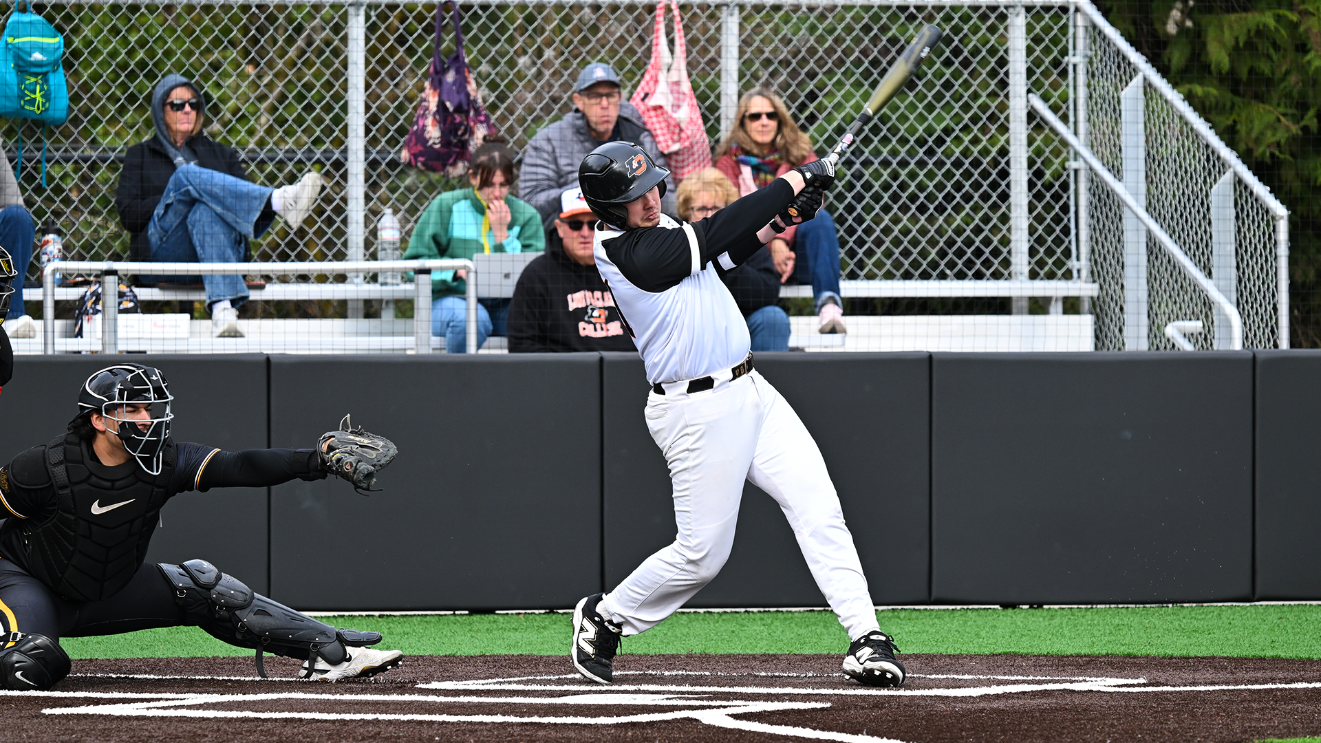 Dylan Lee hits the baseball during the Pacific Lutheran game. 