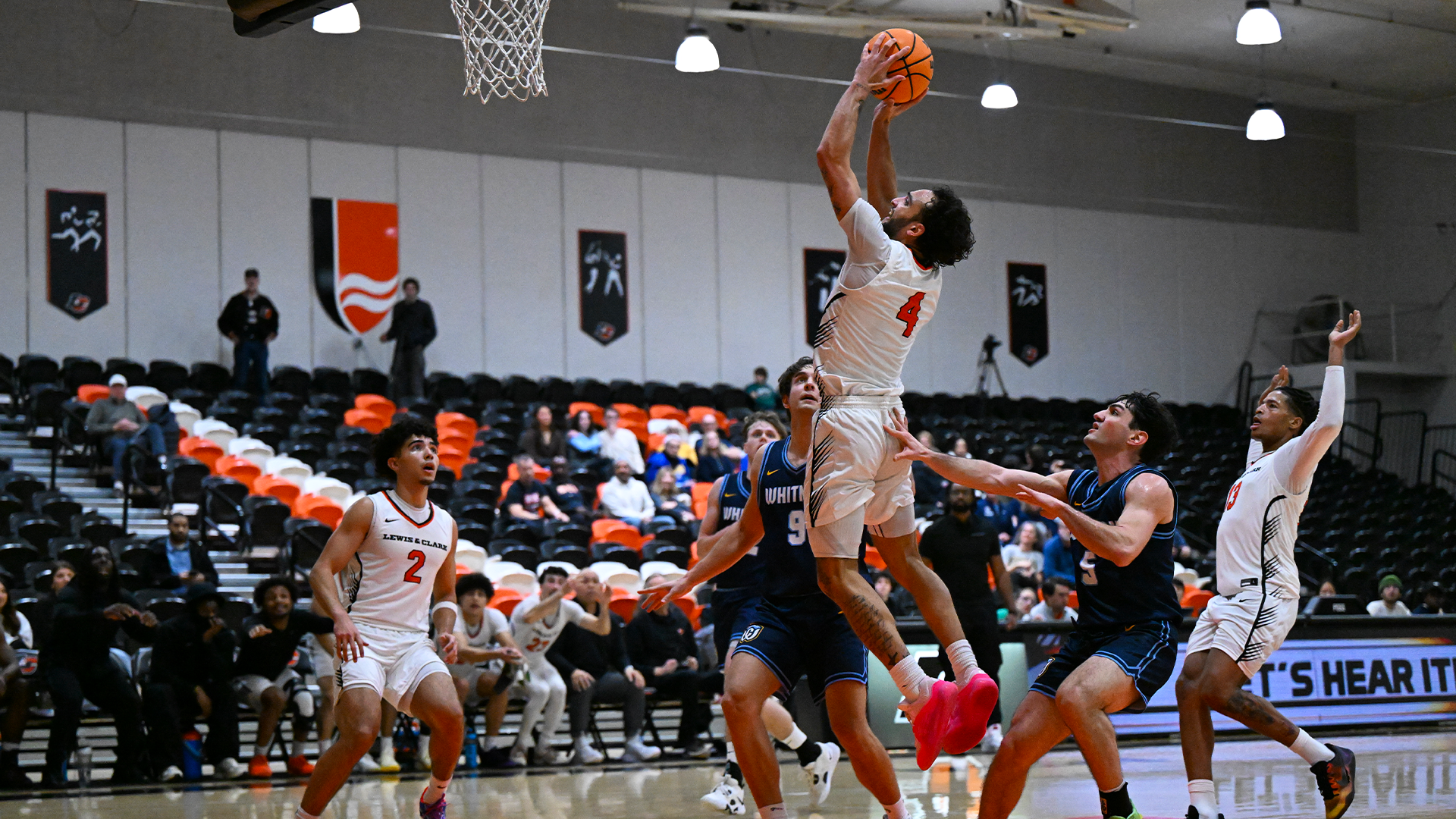 Andre Treadwell goes up for a dunk against defenders
